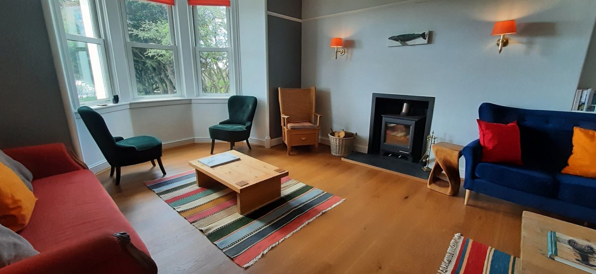 Achaban House - comfortbale lounge with wood burner and views south over the loch