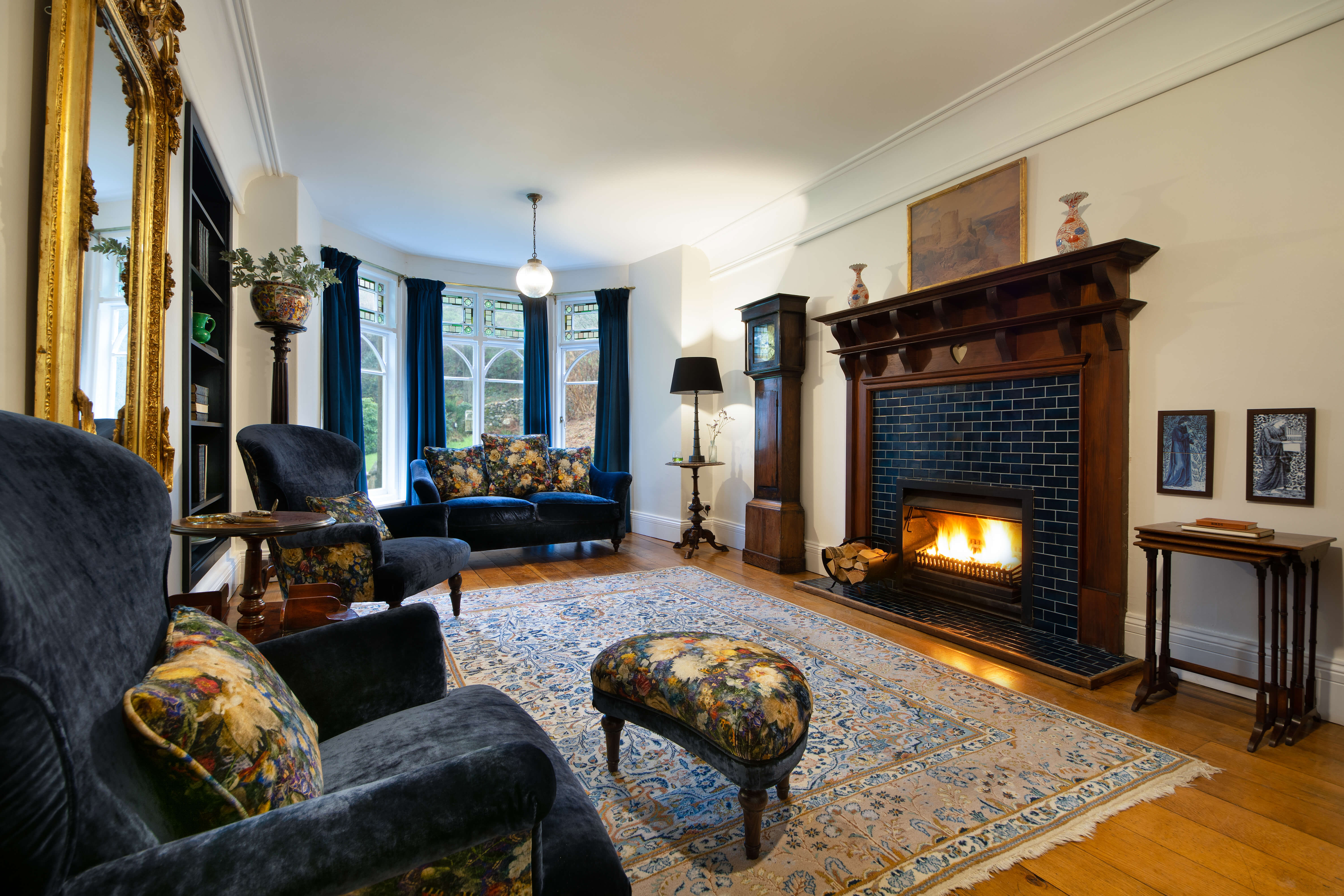 National Trust - Craflwyn Hall - cosy library with a fire