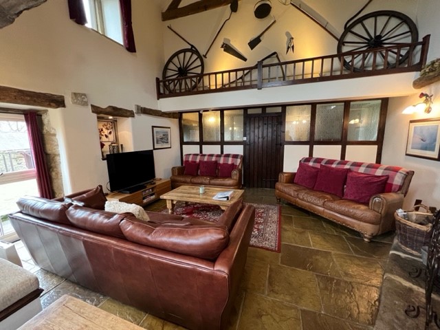 The cosy lounge in the Barn at Holestone Moor Barns