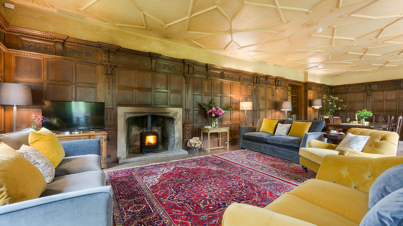 National Trust - Horton Court - sitting room with a wood burner