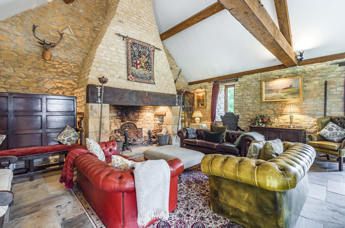 Laverton Hill Farm - stunning Chesterfields to relax next to the open fire in the converted barn