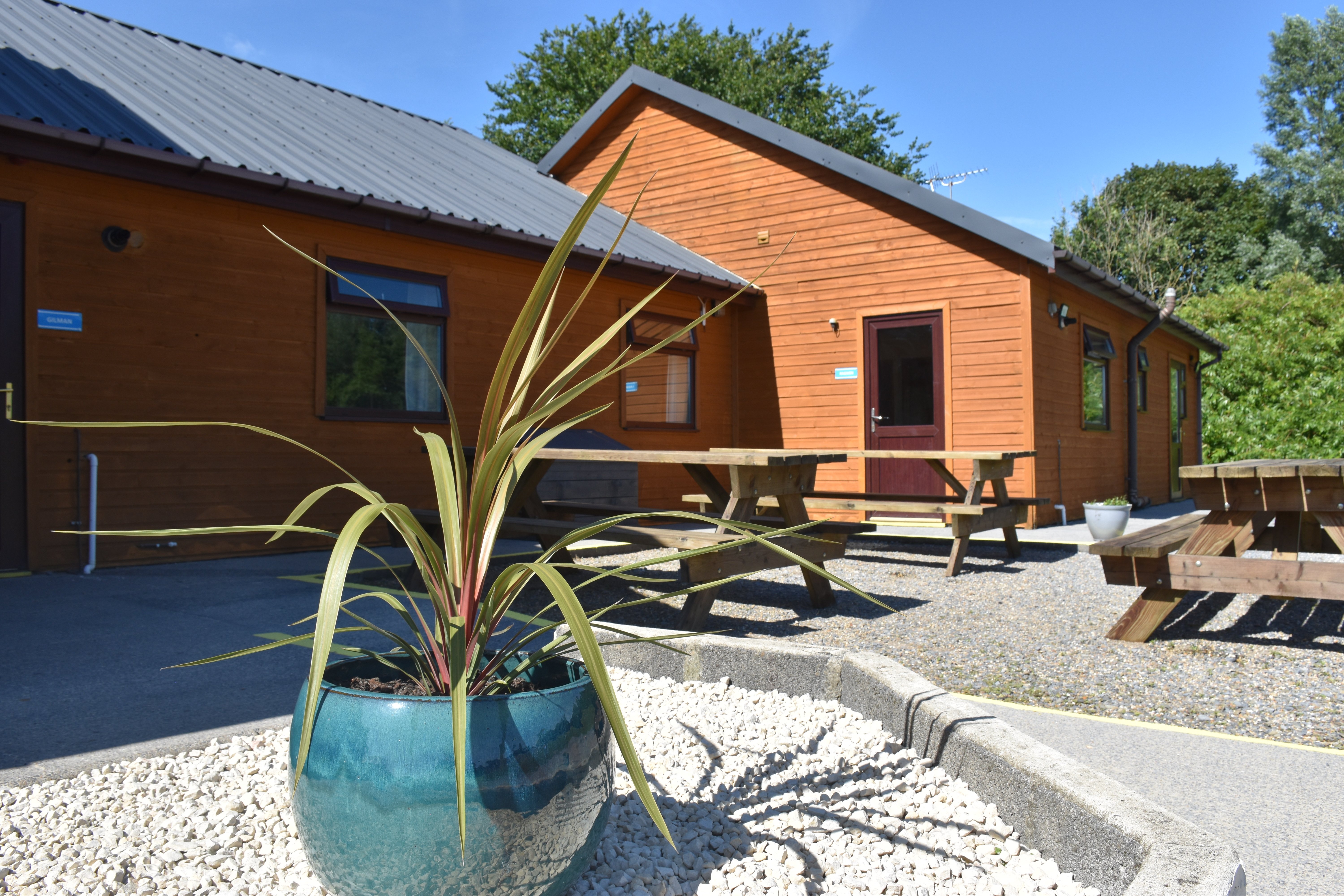 Morfa Bay Adventure - bunkhouse accommodation with outside picnic benches