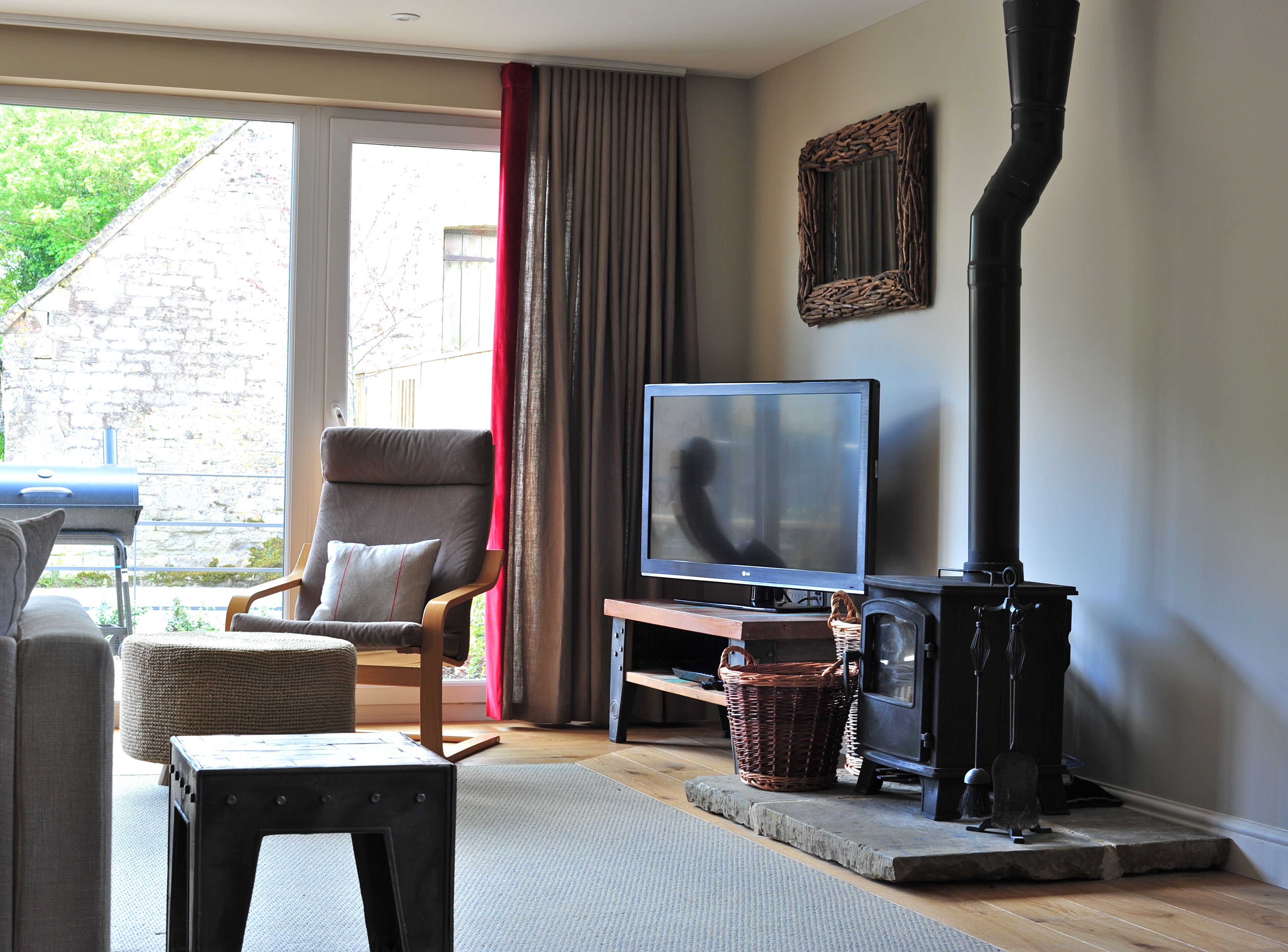 Barns at Notgrove - cosy living space with a wood burner