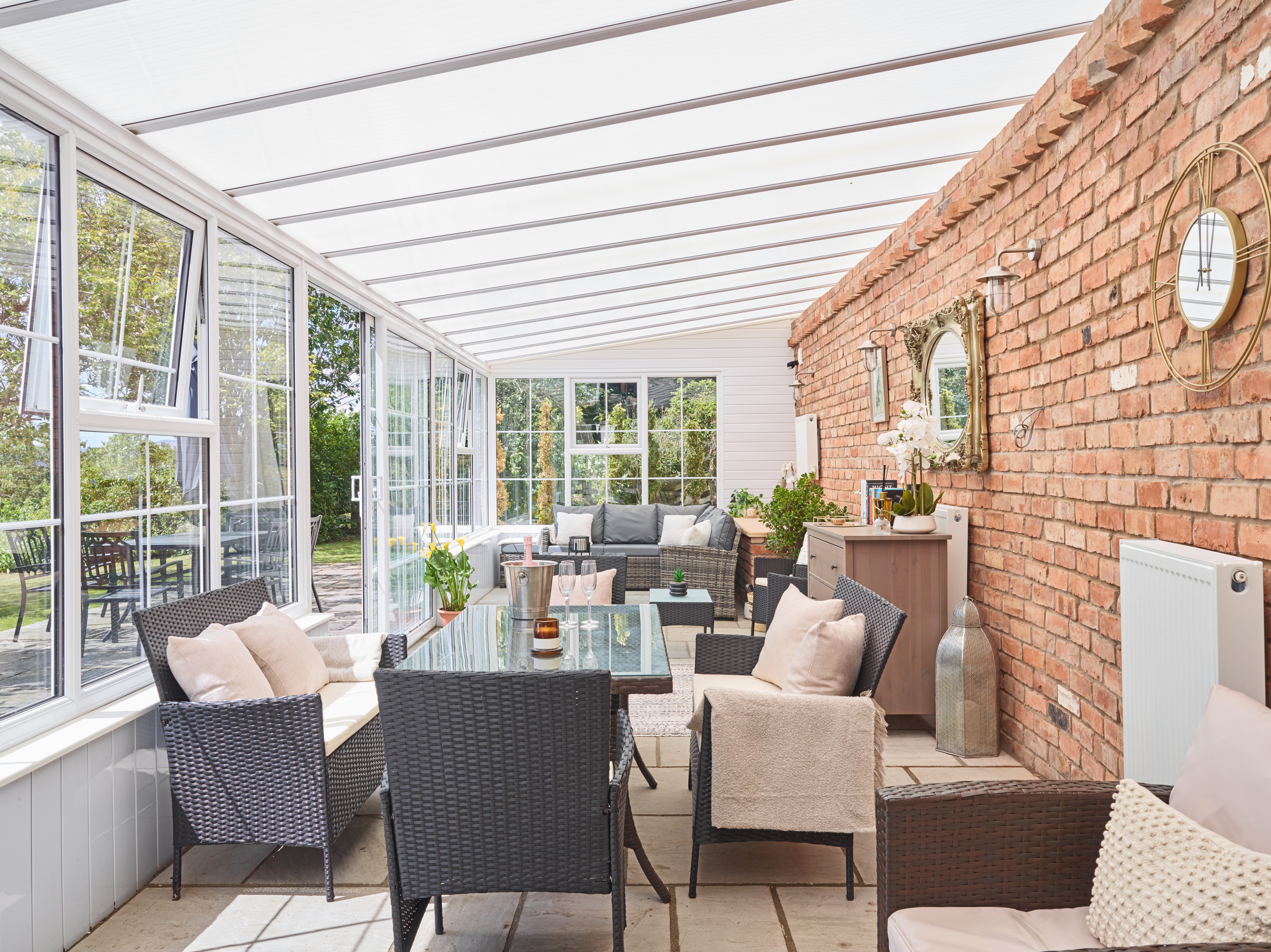 Old Rectory Cottages - huge conservatory with seating and dining table
