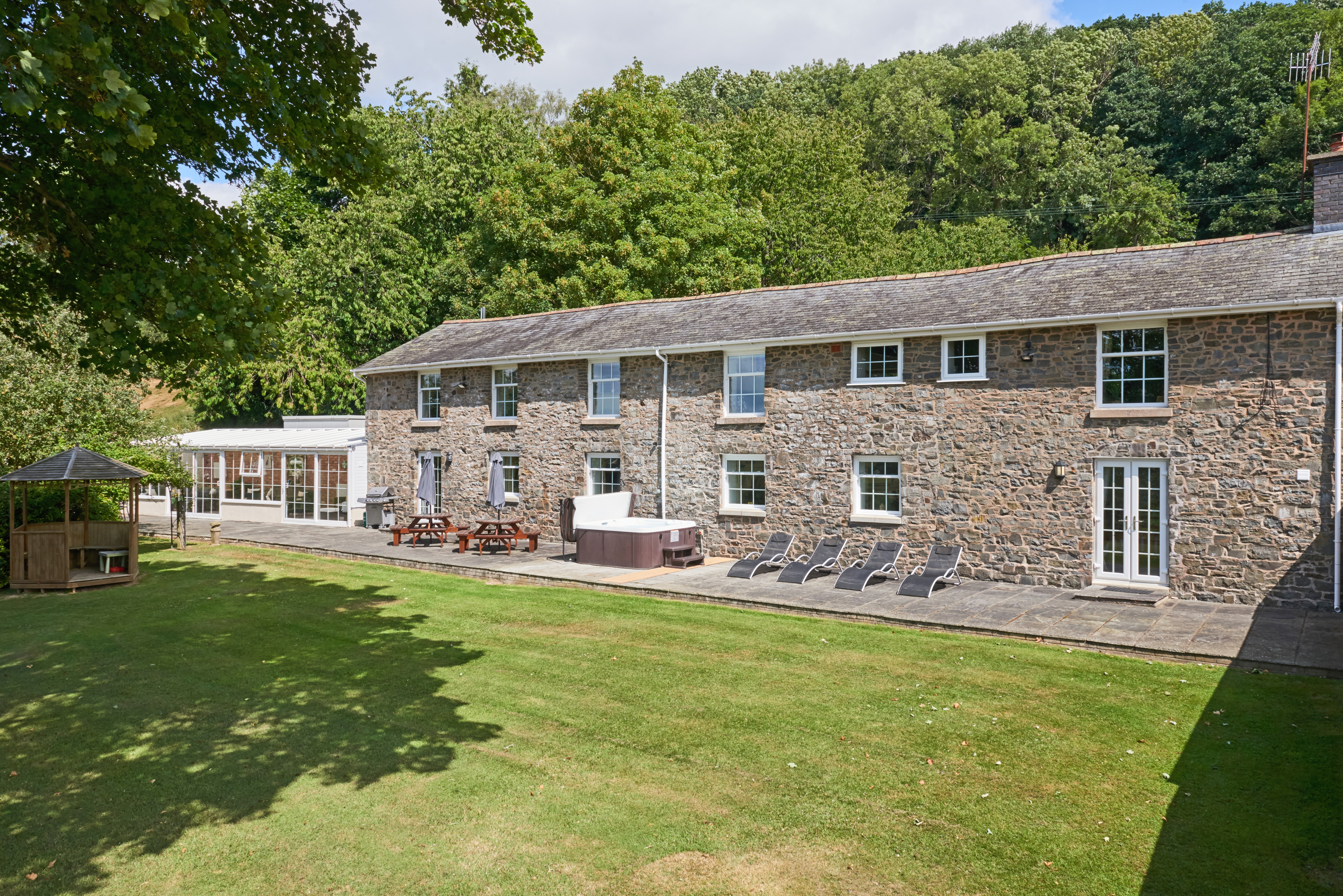 Old Rectory Cottages - sunloungers, a hot tub and outside dining space