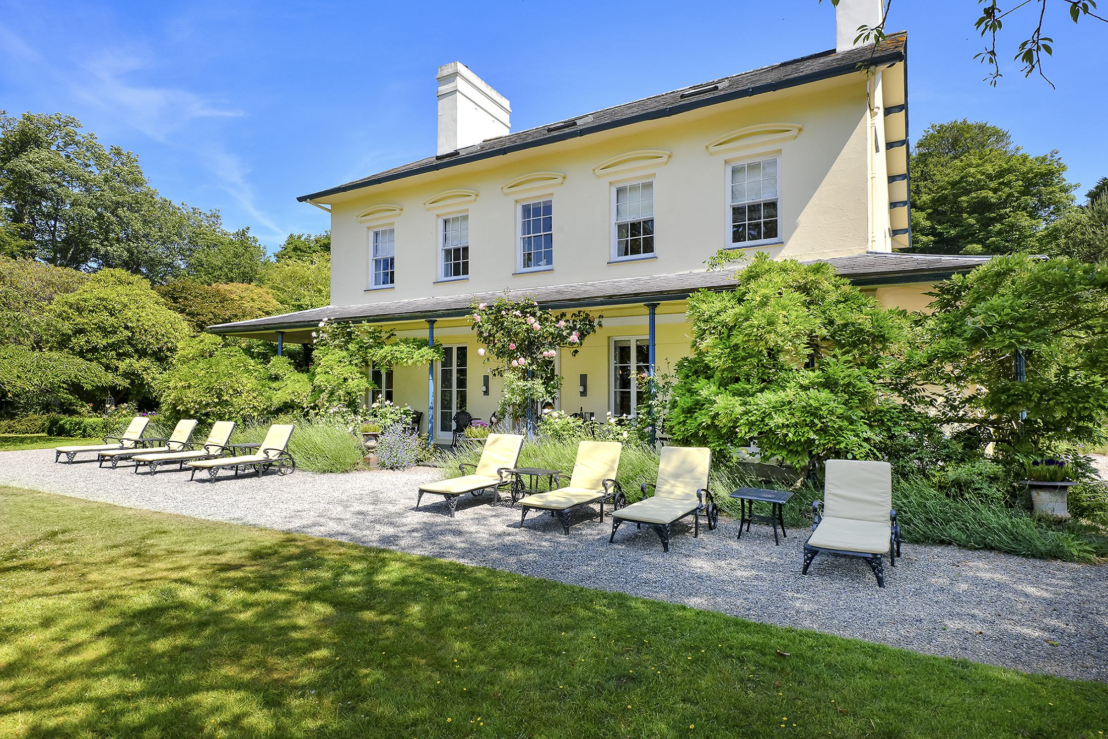 Plas Bodegroes - relax on sun loungers at the front of the house