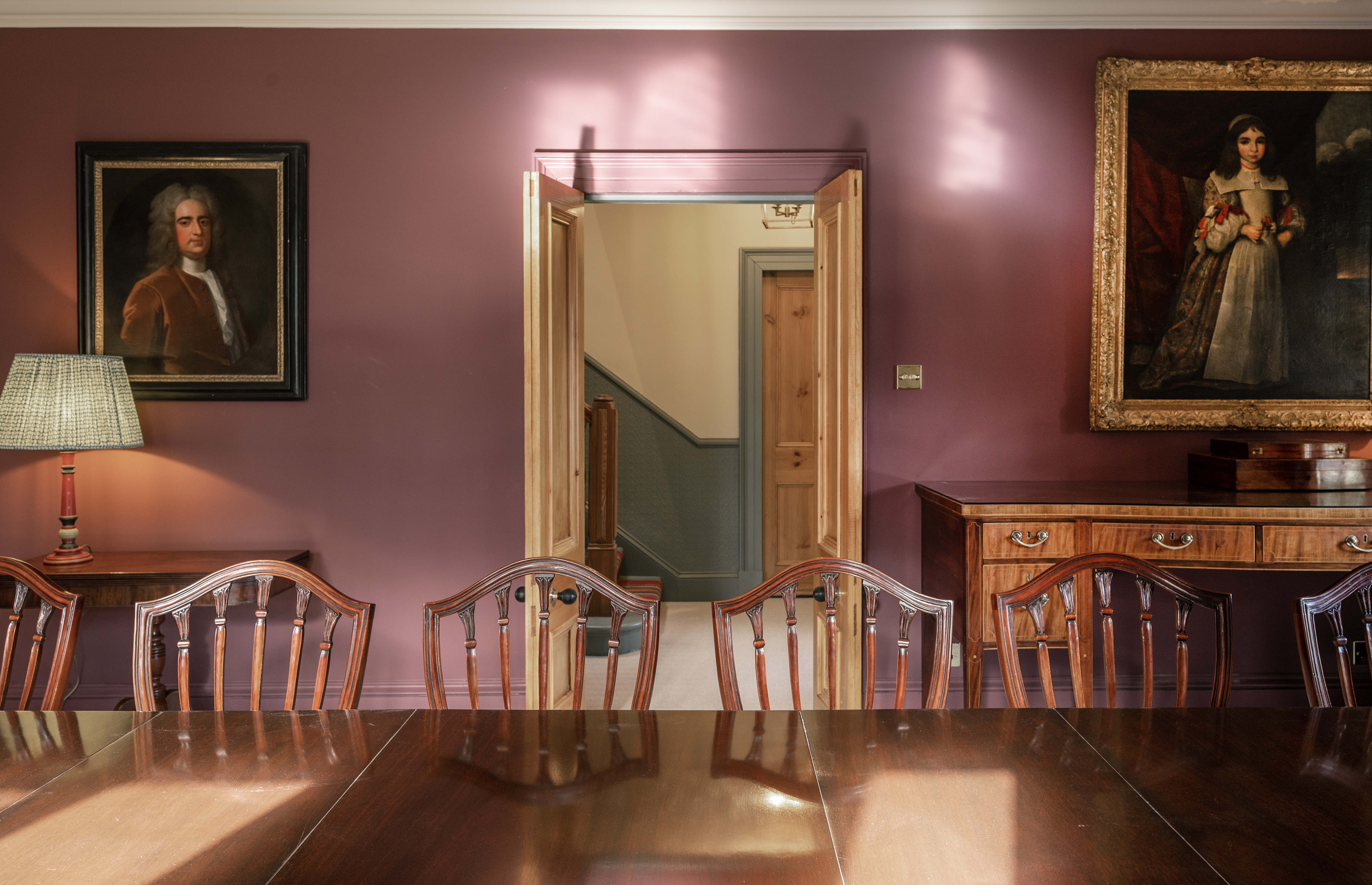 Delnabo - formal dining room with ancestral portraits looking on
