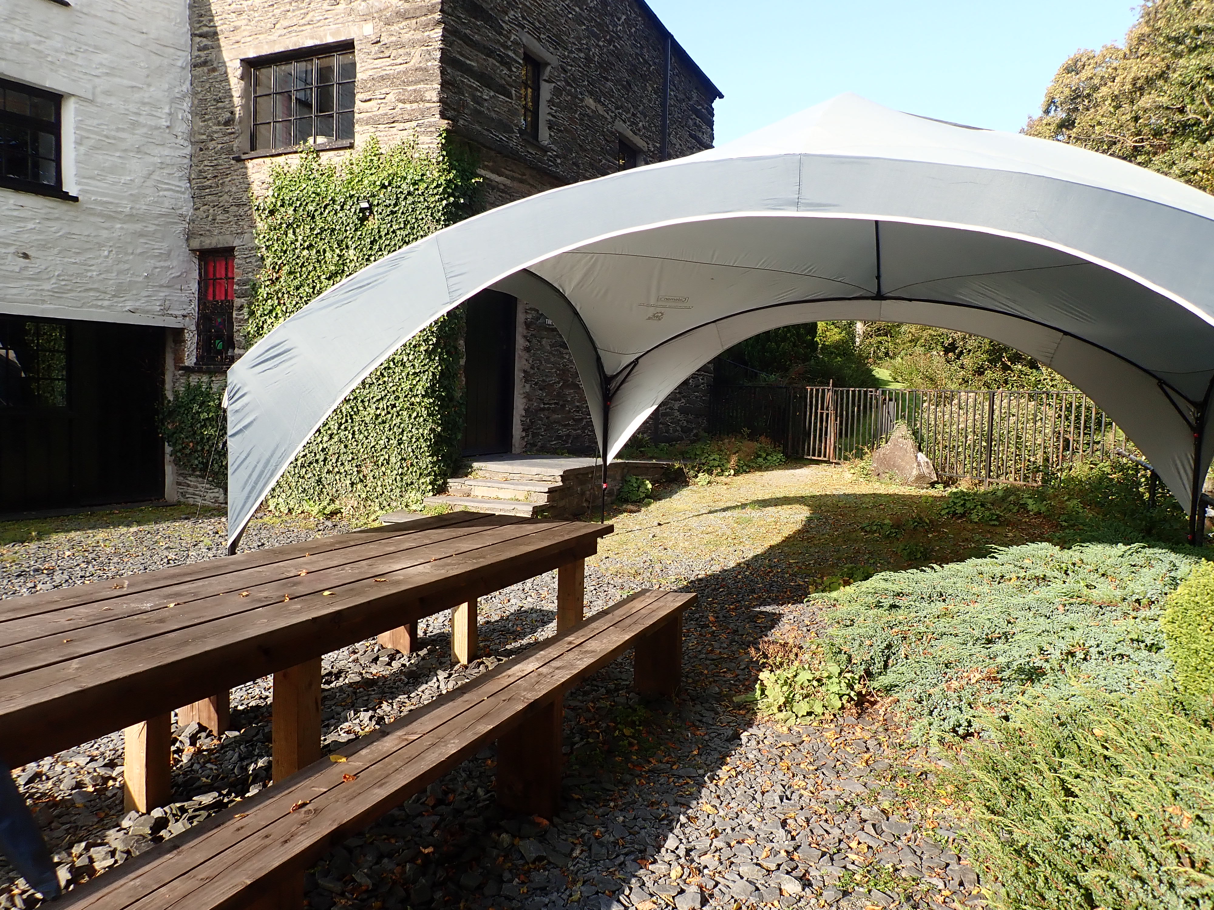 Felin Crewi Cottages - Watermill outside dining which can be under the canopy