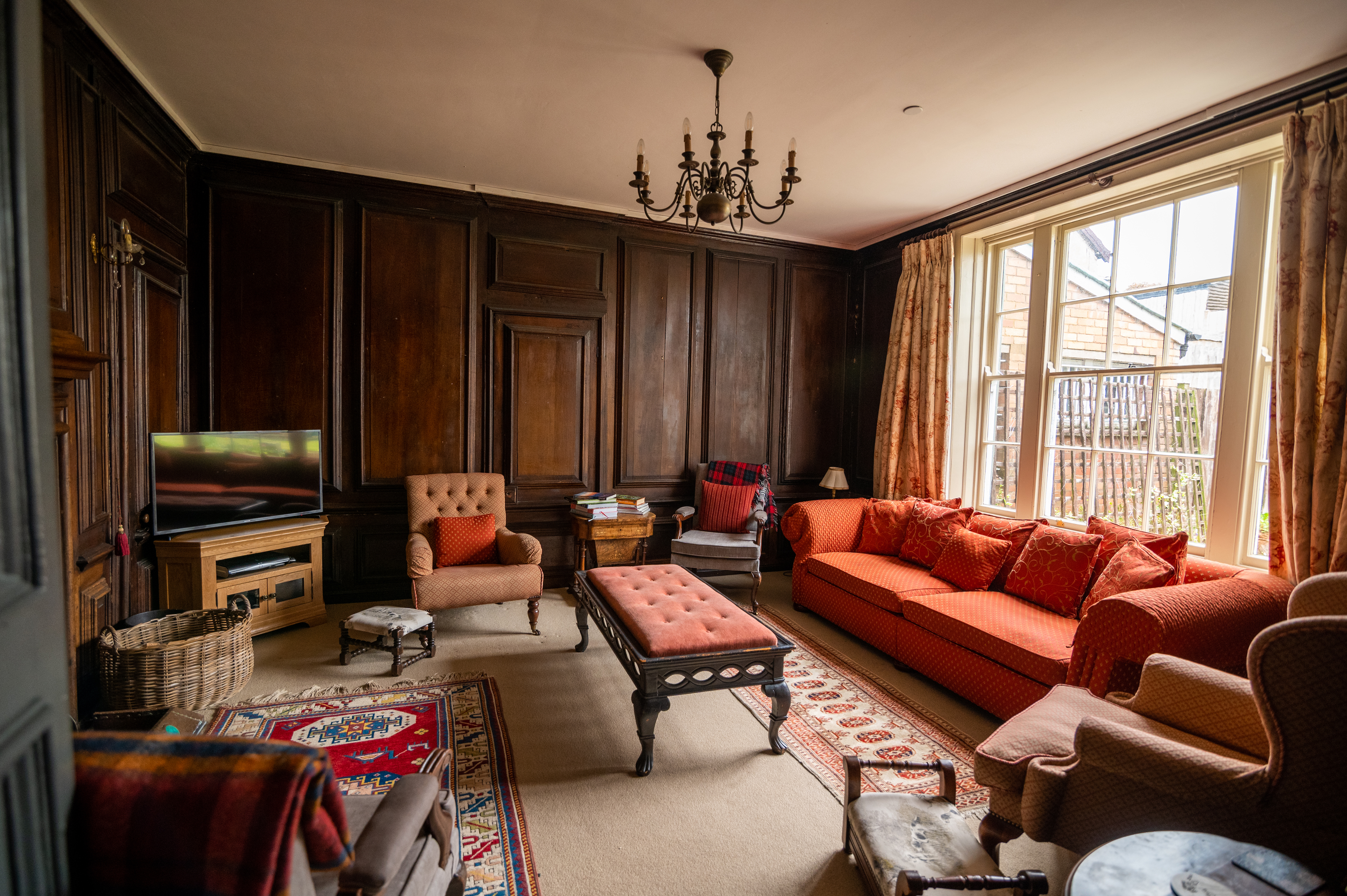 Bank House Shropshire – wood panelled drawing room with luxury sofas