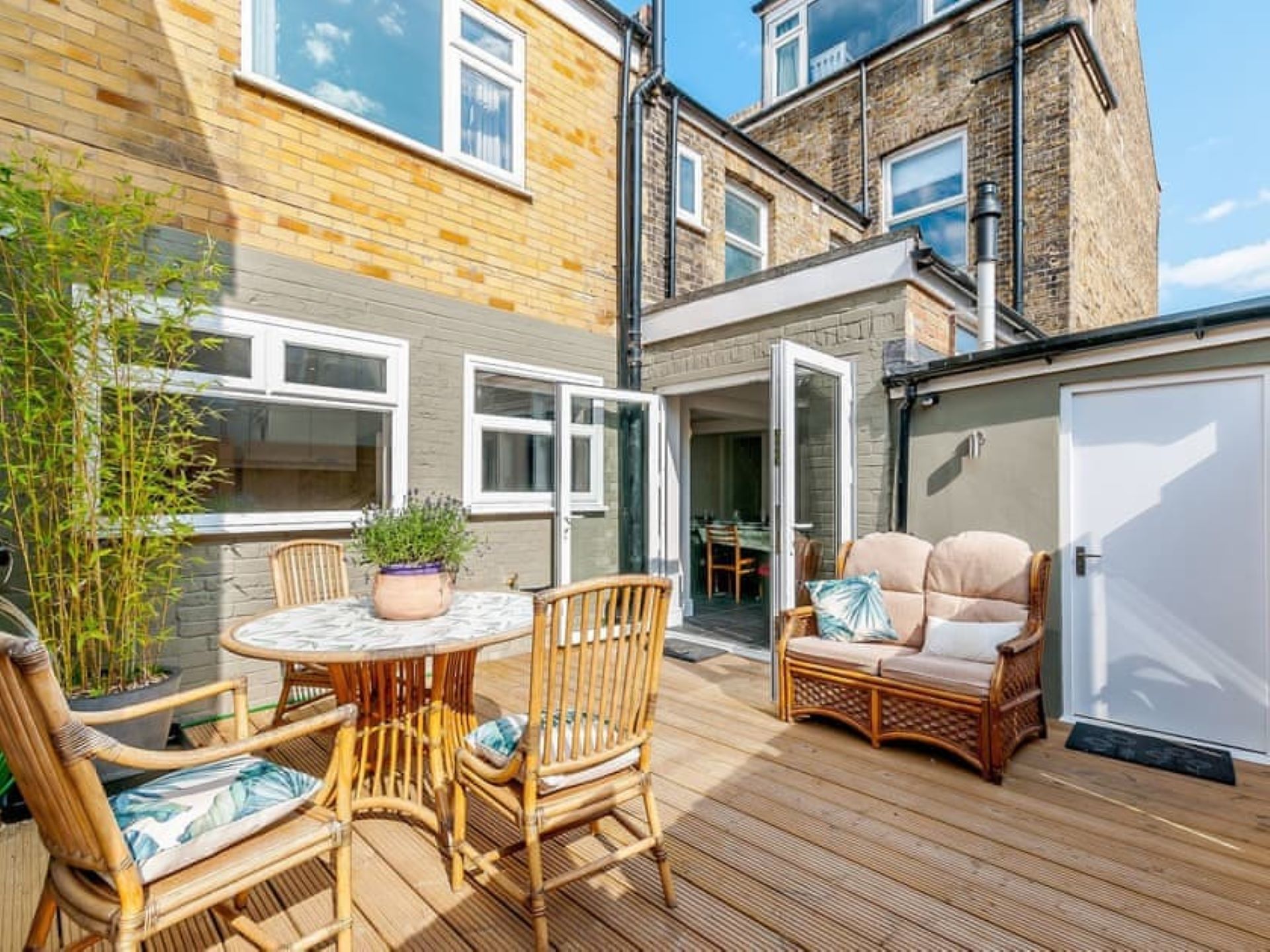 Walpole House - front house patio with dining and relaxed seating