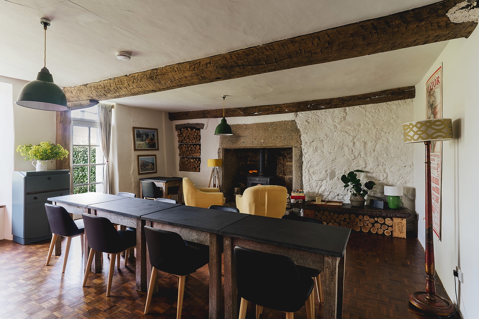 Weeke Barton – dining table next to the cosy wood burner