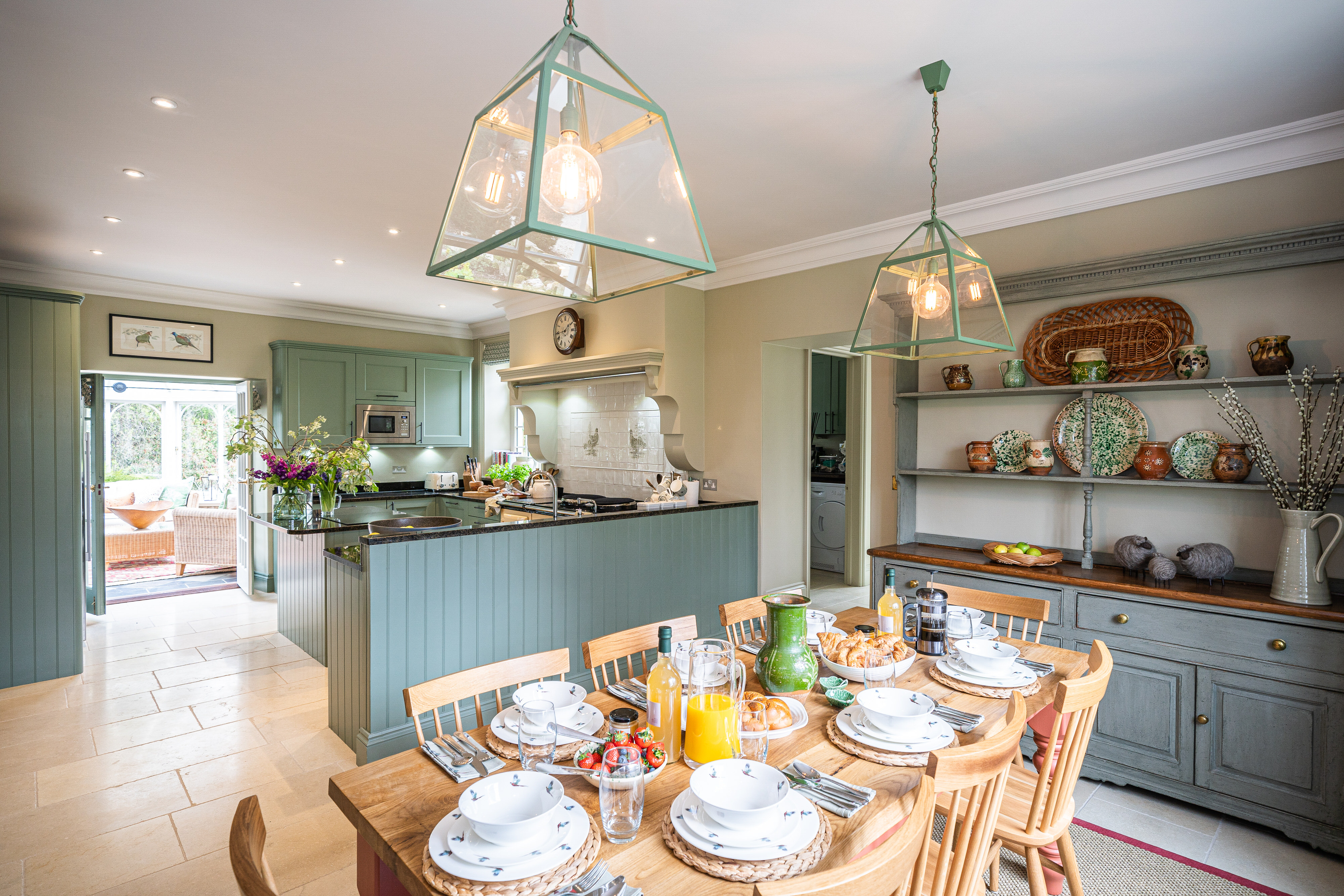 Old Vicarage Farndale - green wood kitchen well equipped with island and breakfast table