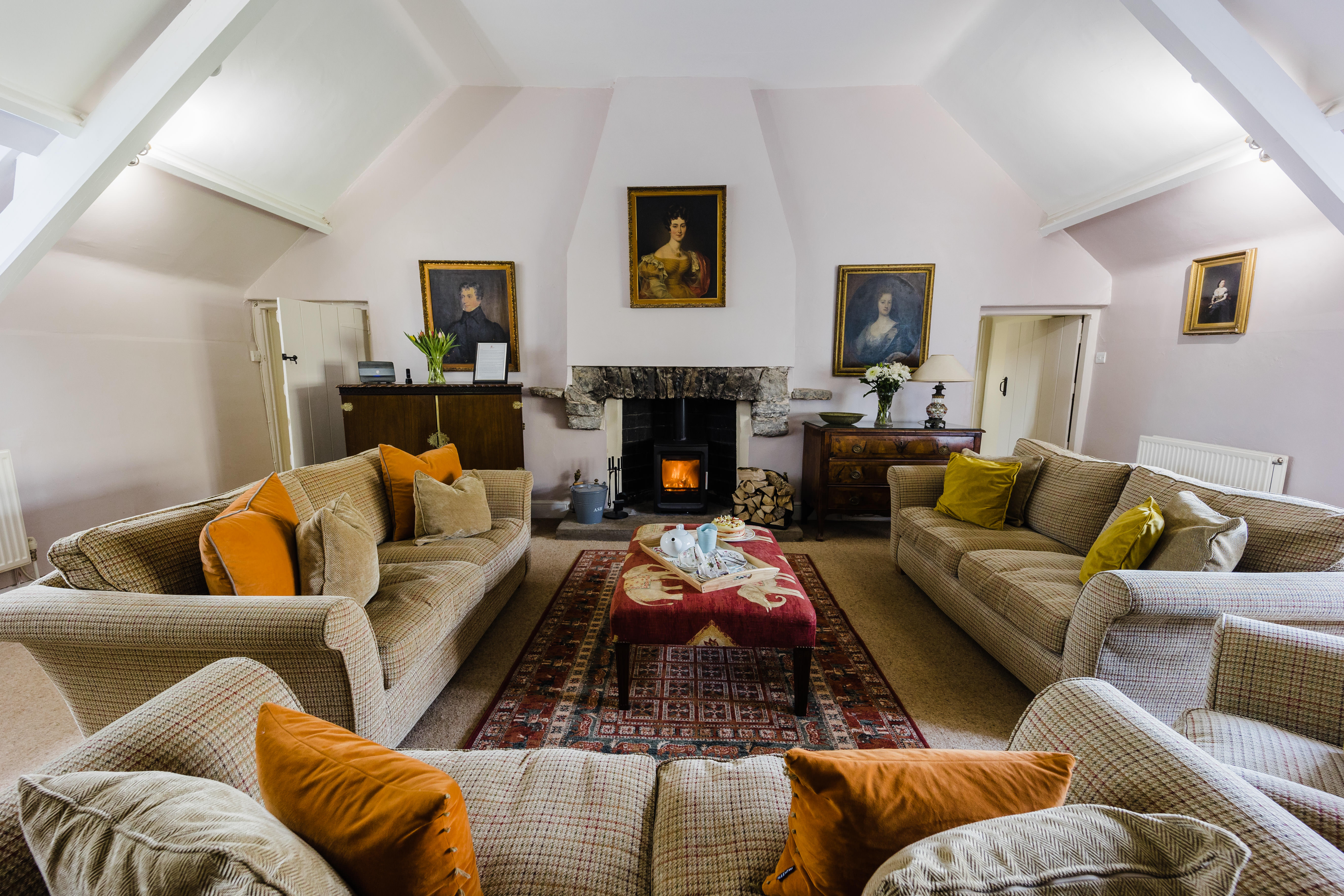 Manorbier Castle - Castle House lounge with wood stove