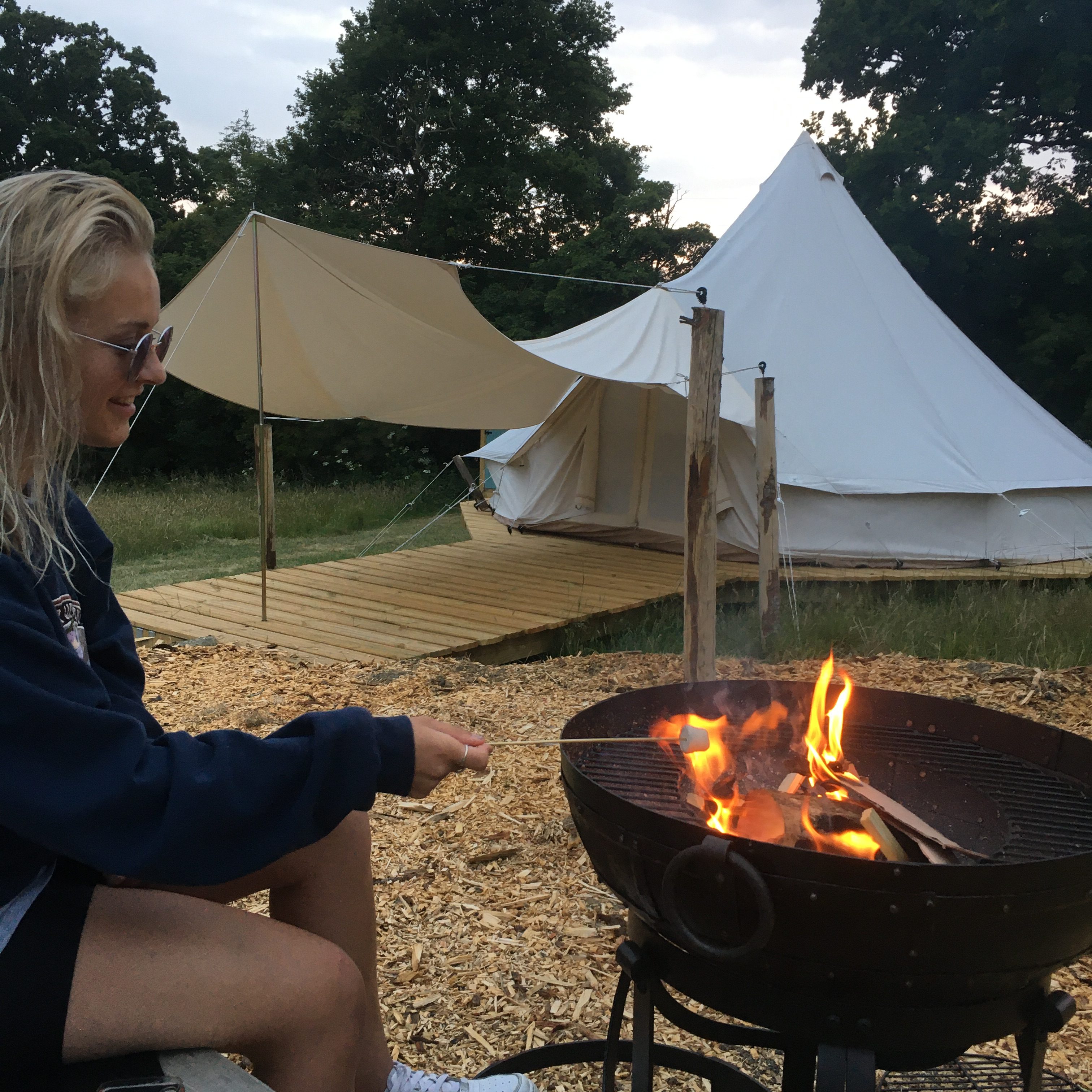 Star Field Glamping - toasting marshmallows around the firepit