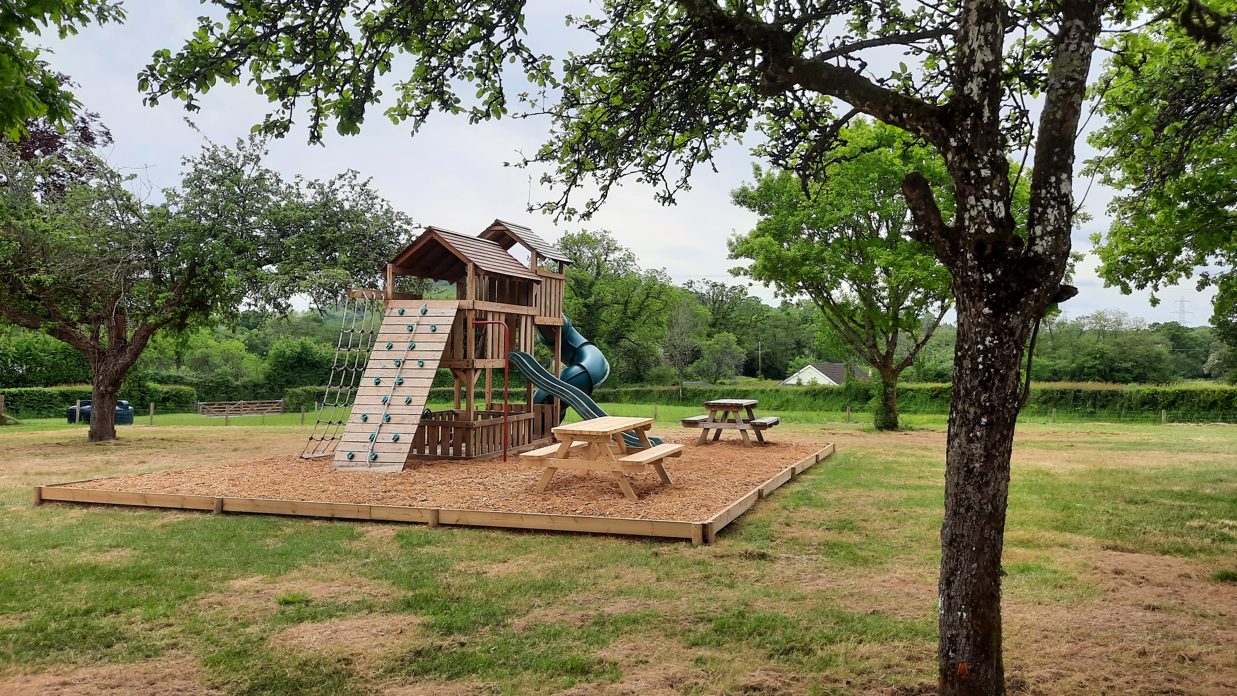 The Elms Devon - children's play area with benches for mums and dads