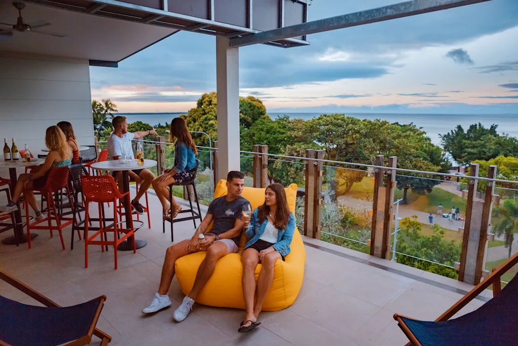 Global Backpackers Cairns - a drink on the roof terrace gazing out at sea views