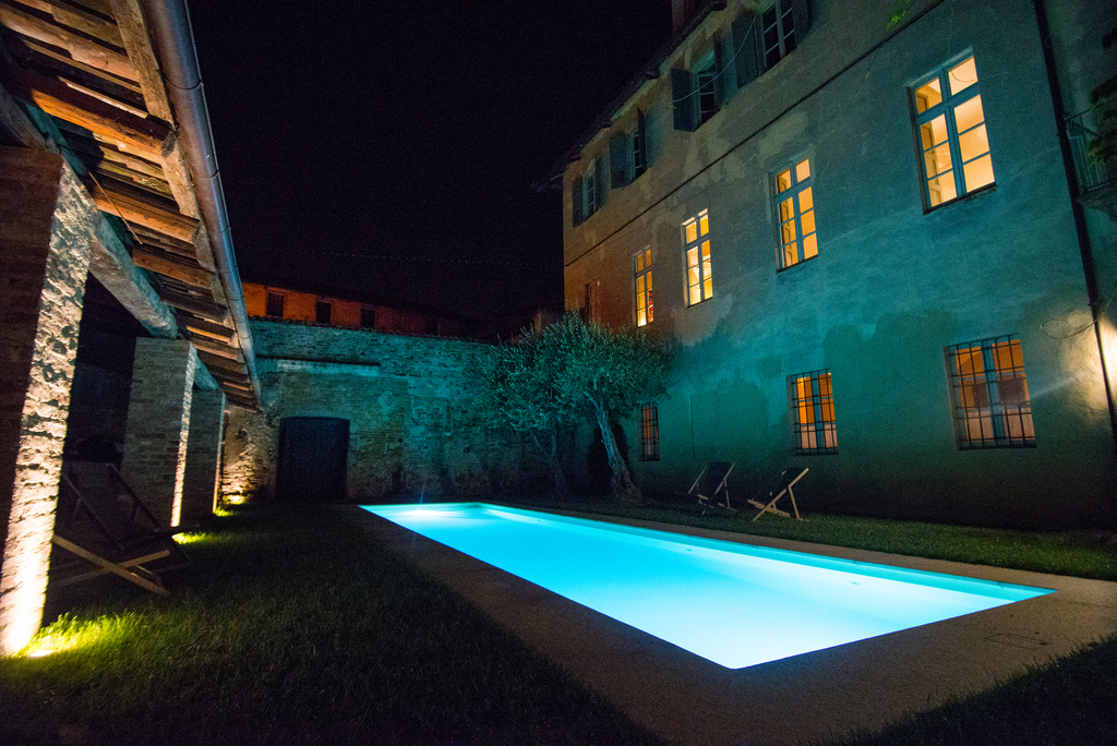 Castel Garrone - pool lit up at night