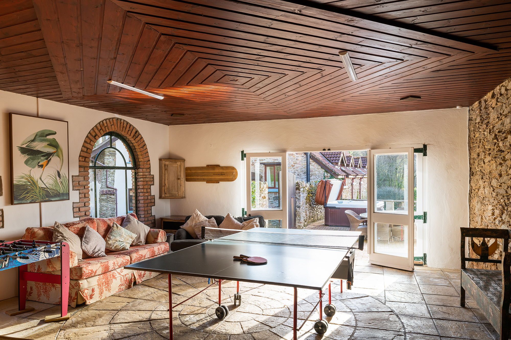 Coulscott House - games room with doors opening onto terrace with hot tub