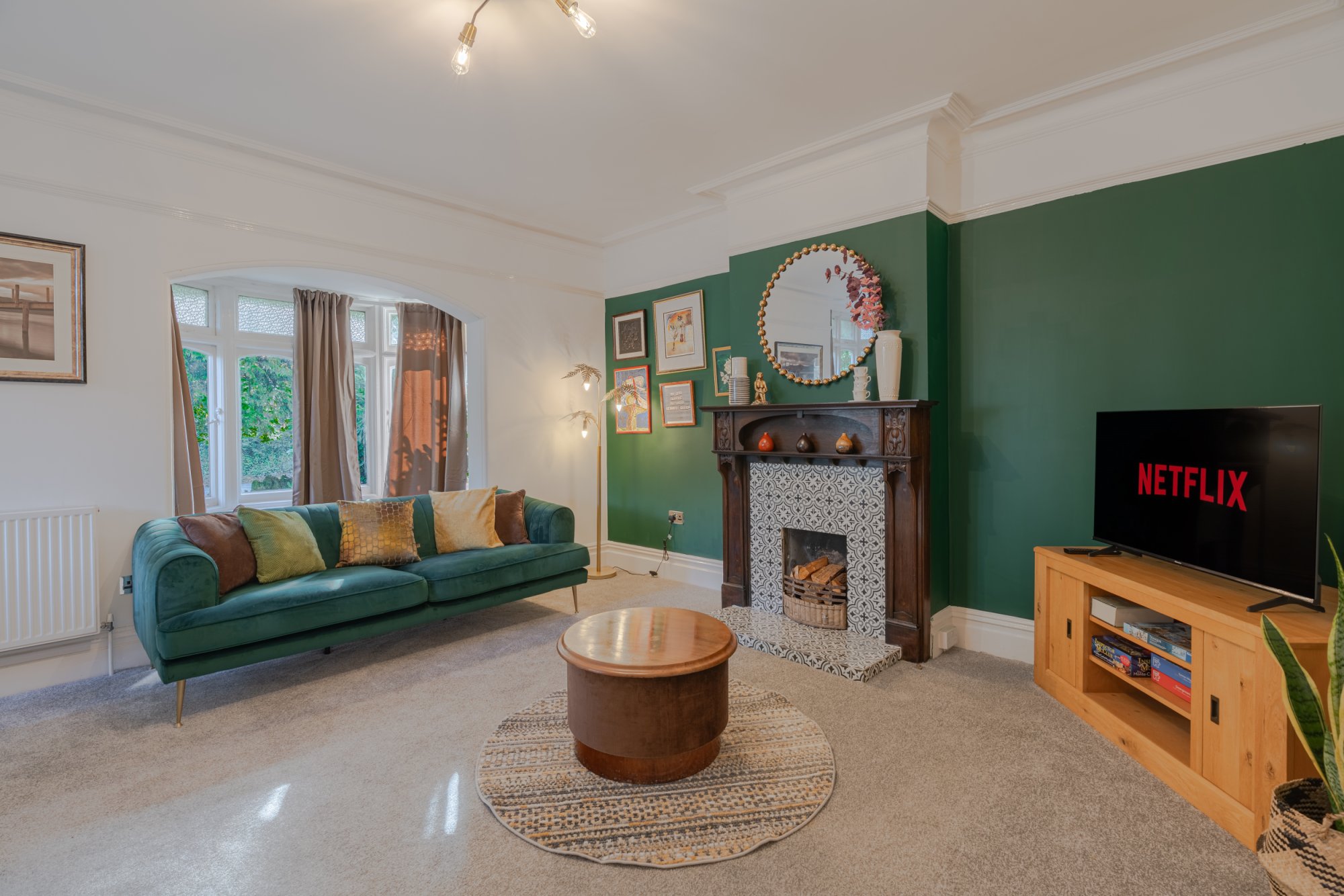 The Bloxham House - large lounge with fireplace and TV