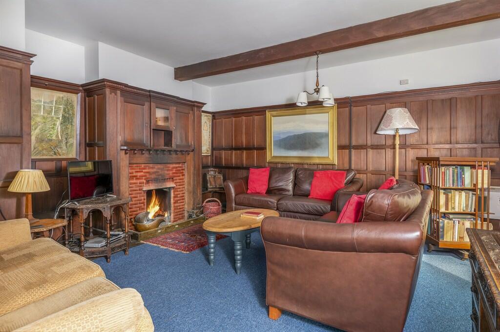 The Coppice - plenty of leather sofas and a roaring fire in the drawing room