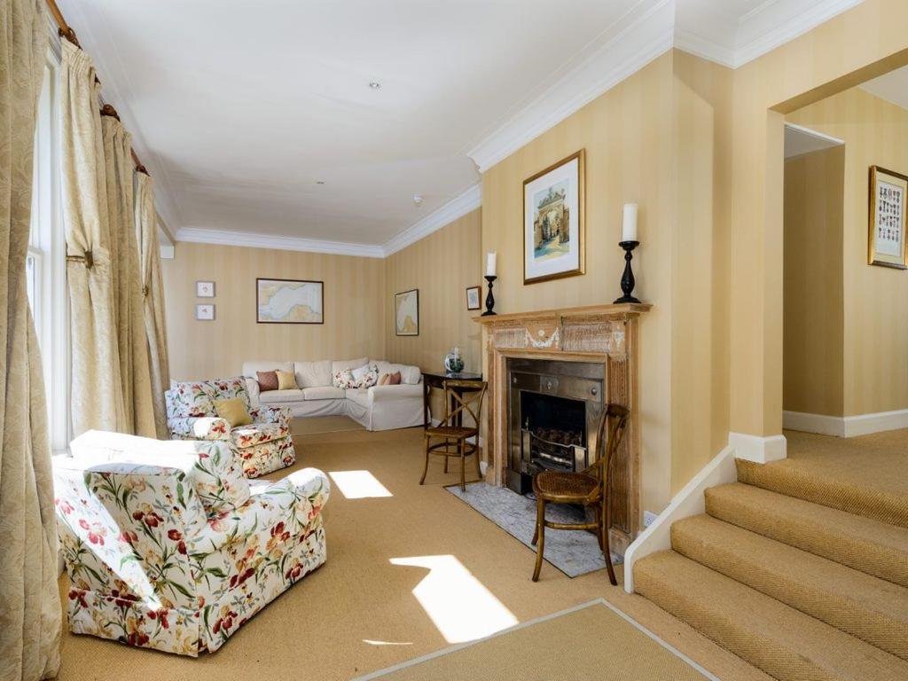 Green Craig - elegant lounge with large windows and open fire