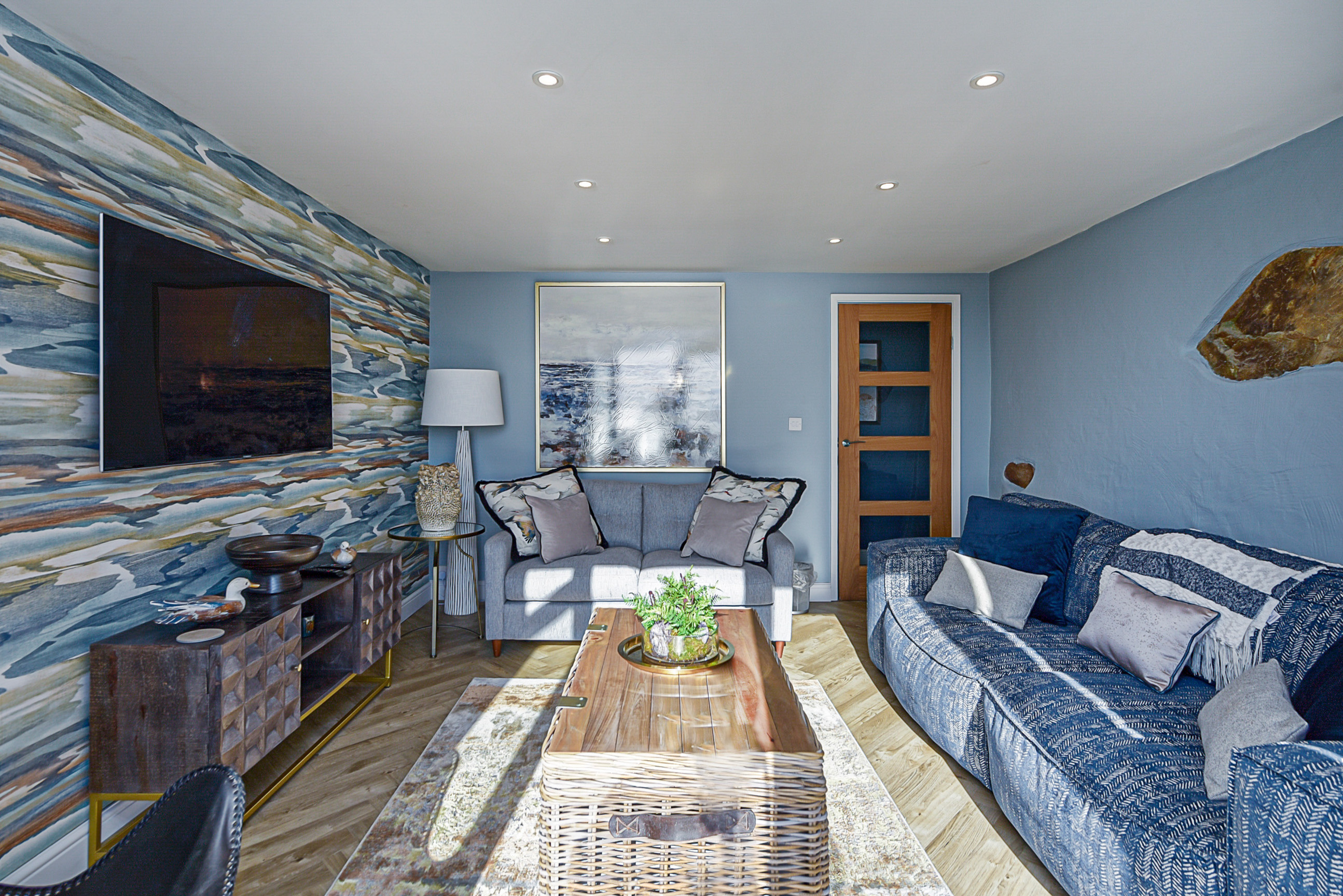 Goferydd - the small lounge with lots of comfy seating and a large TV