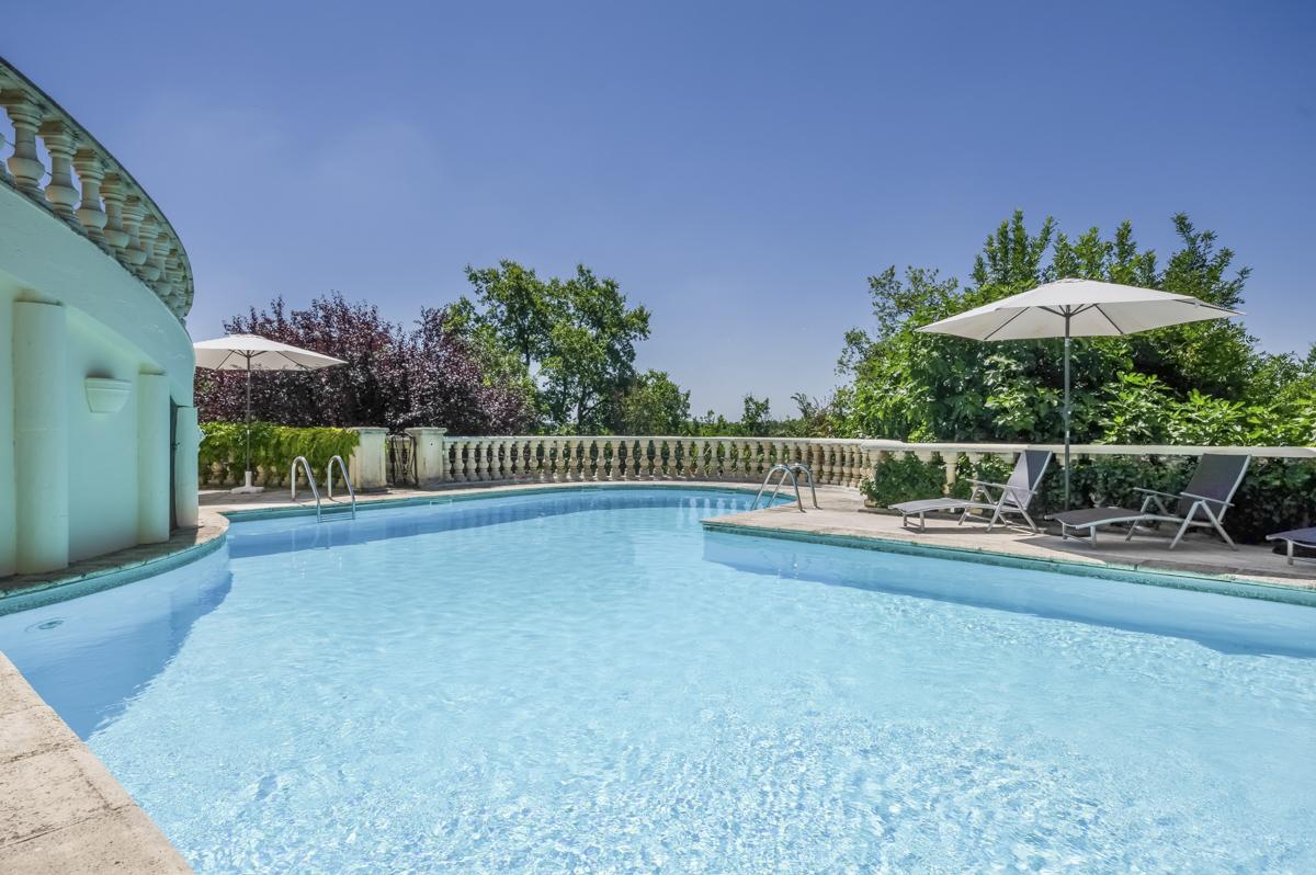 Chateau Joncasses - sun terrace next to the pool with loungers