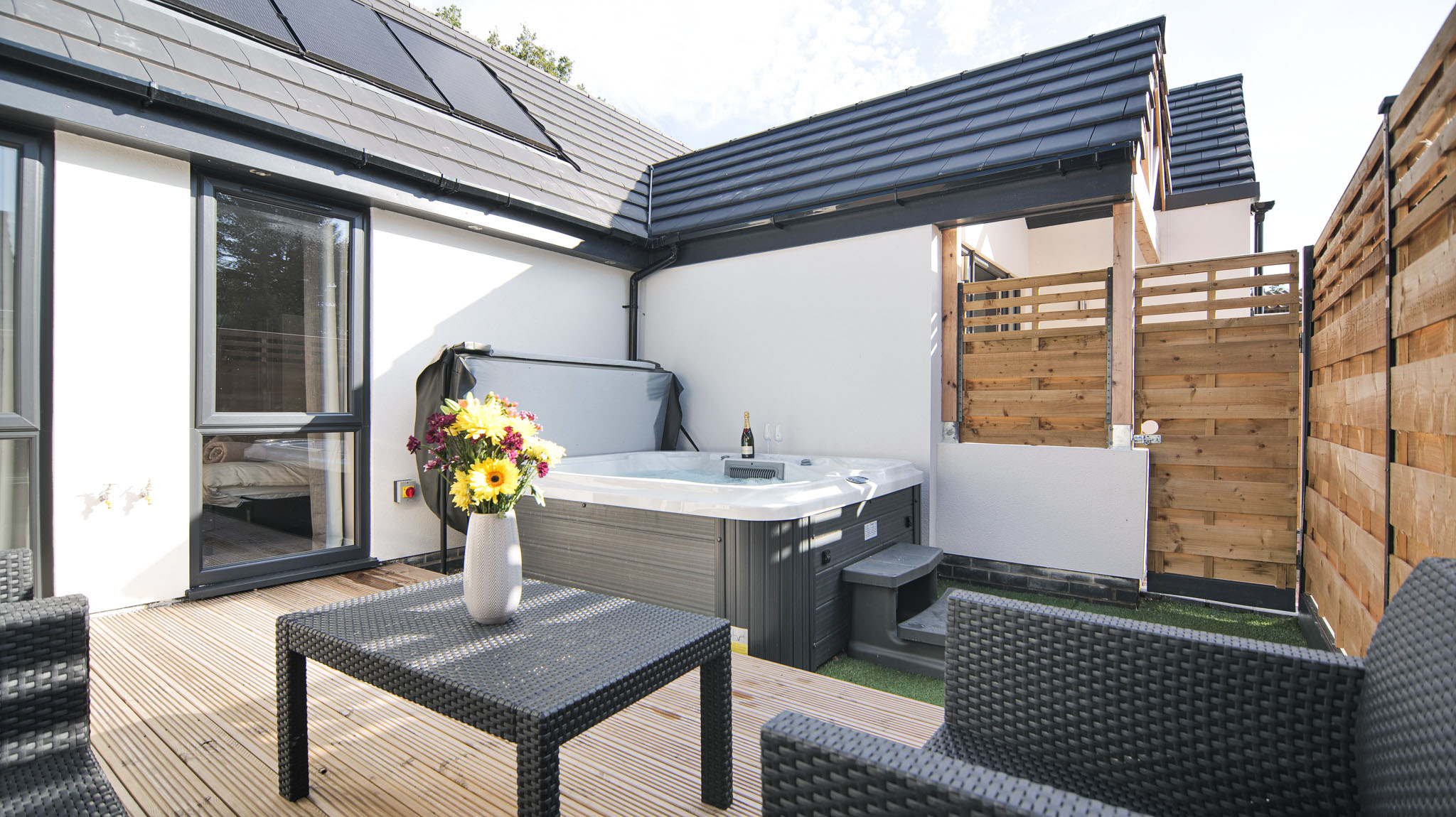 Hoxne Cottages - relax in the hot tub with a glass of fizz