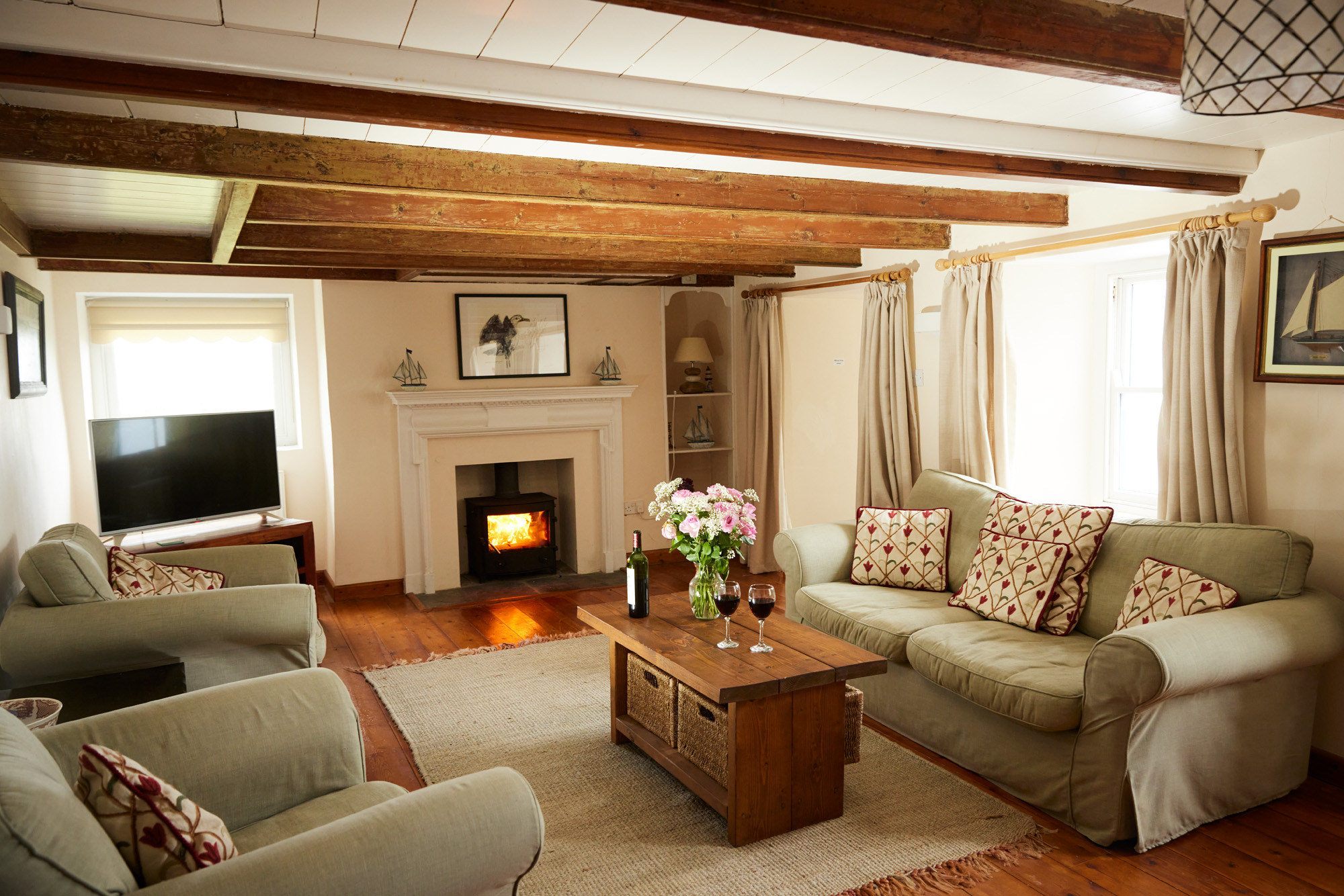 Trevara - lounge with cosy woodburner