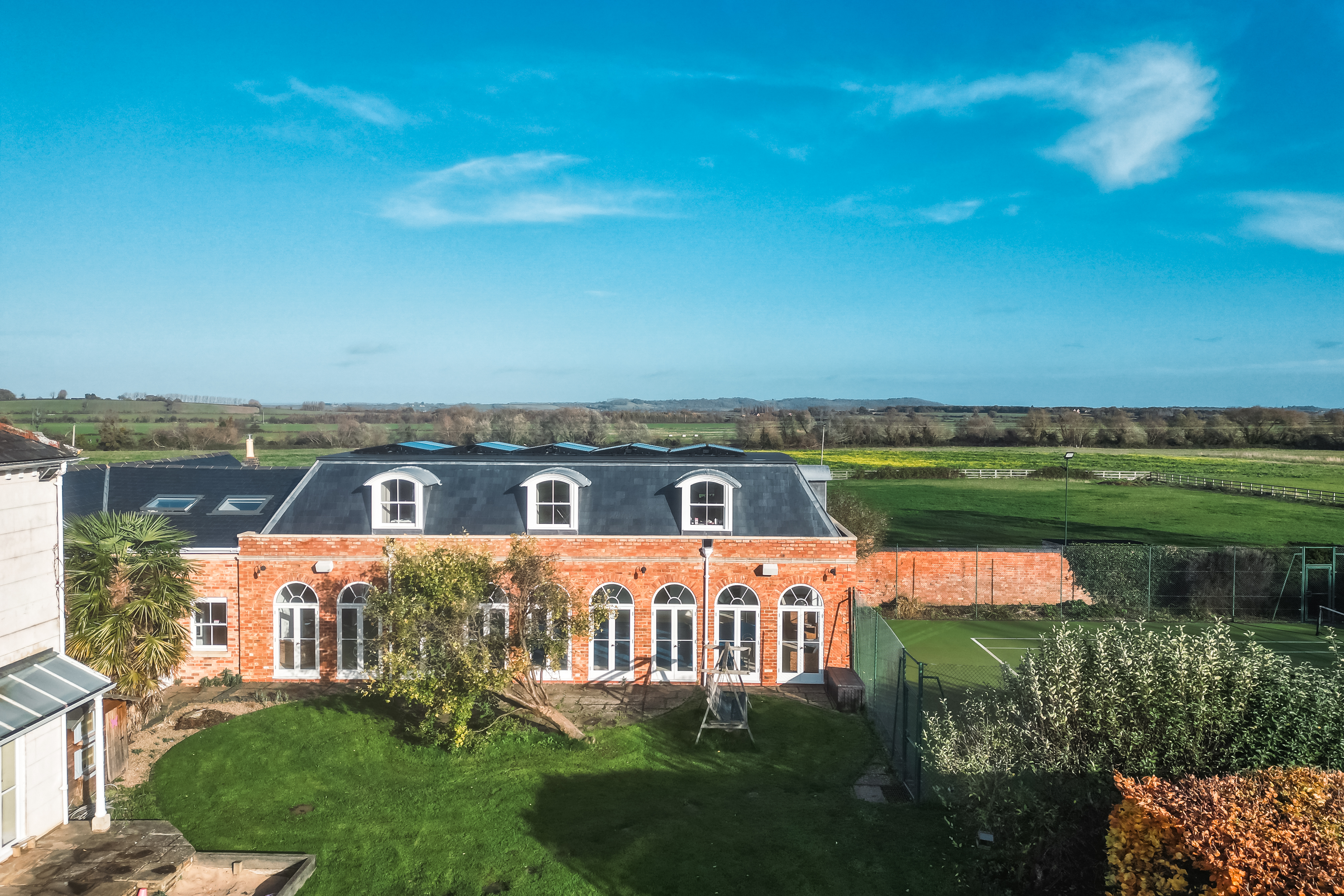 Well Furlong Retreats - drone shot of cottage in surrounding grounds