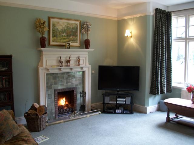 Cosy sitting room with open fire