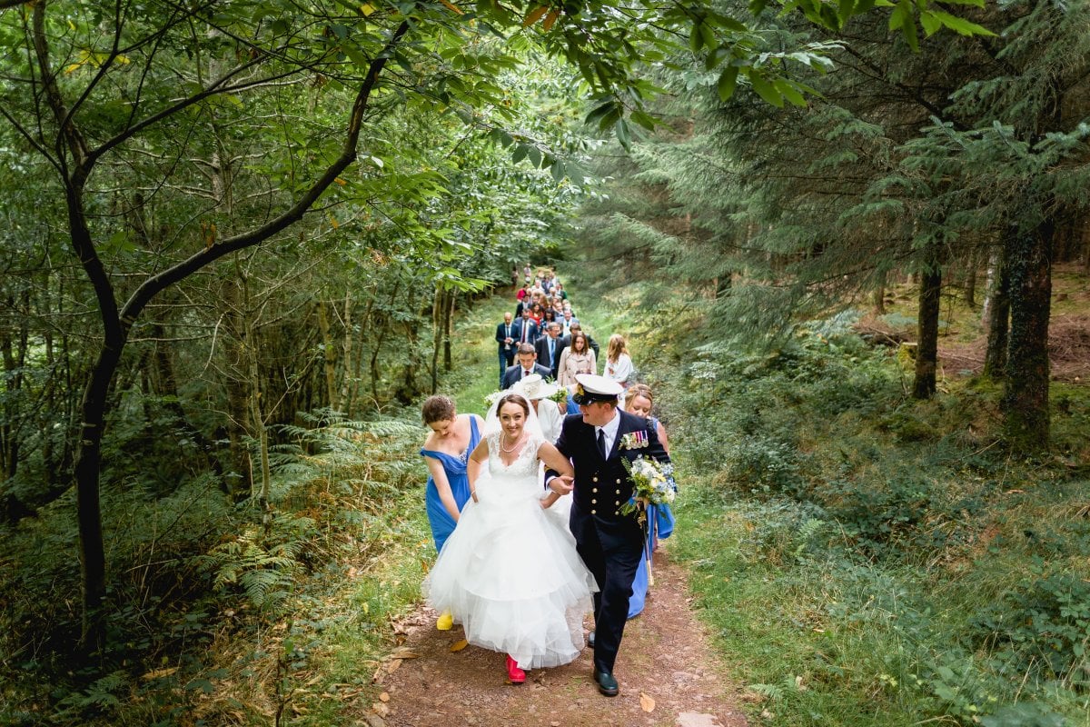 Walking through the enchanted woods to the oak tree for toast and speeches!