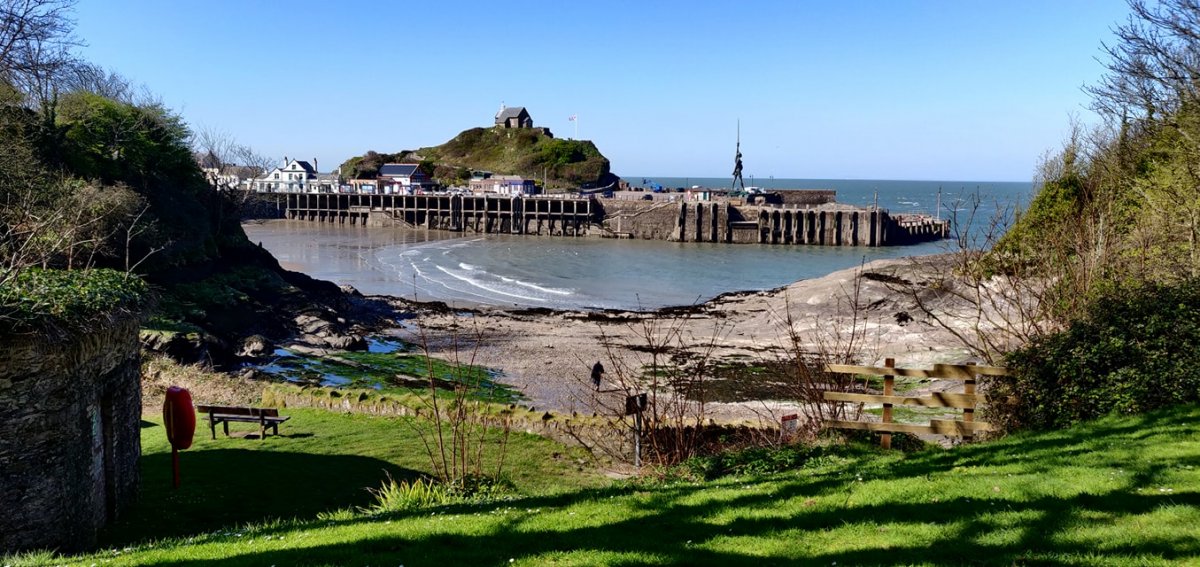 Ilfracombe Harbour and Damien Hirst's 'Verity' from the nearby Larkstone beach