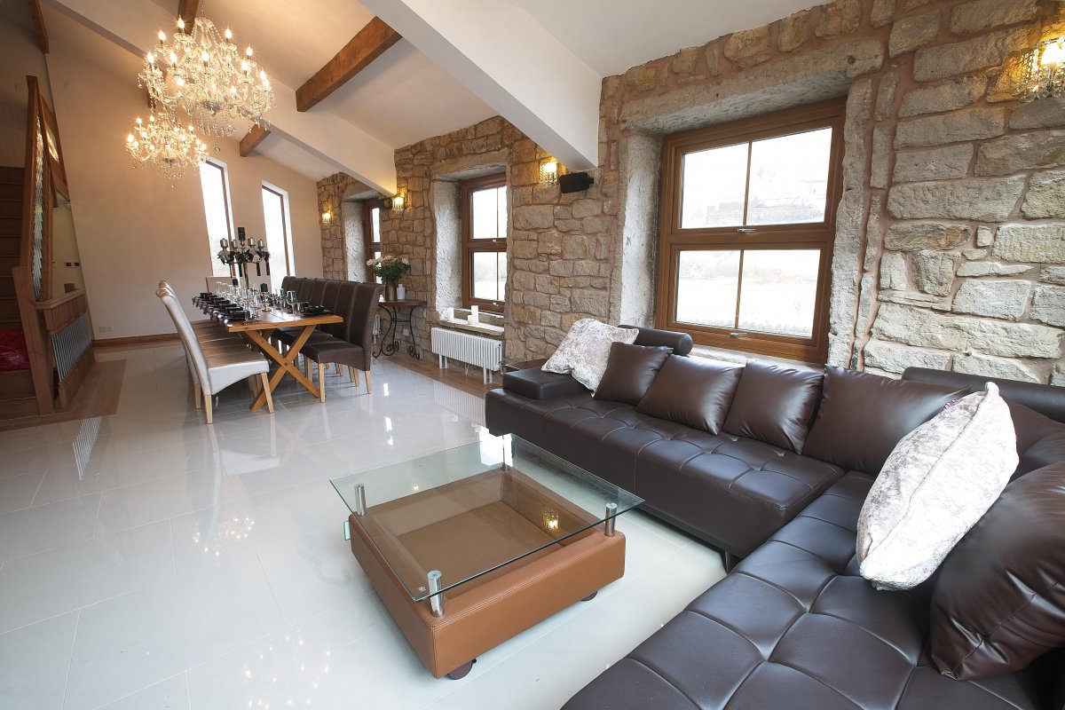 Bird ith Hand Manor - comfy leather sofas to relax on in the dining hall