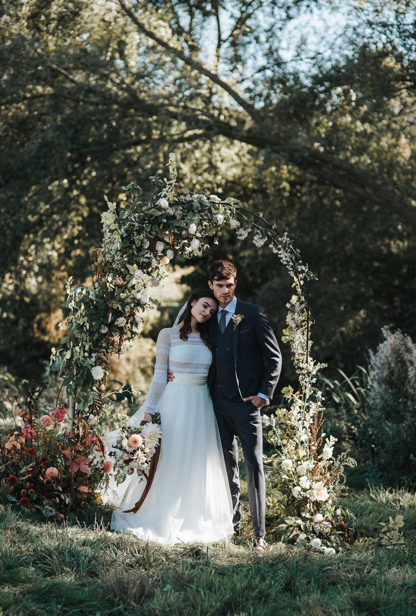 Have your ceremony under a stunning flower arch by our babbling brook