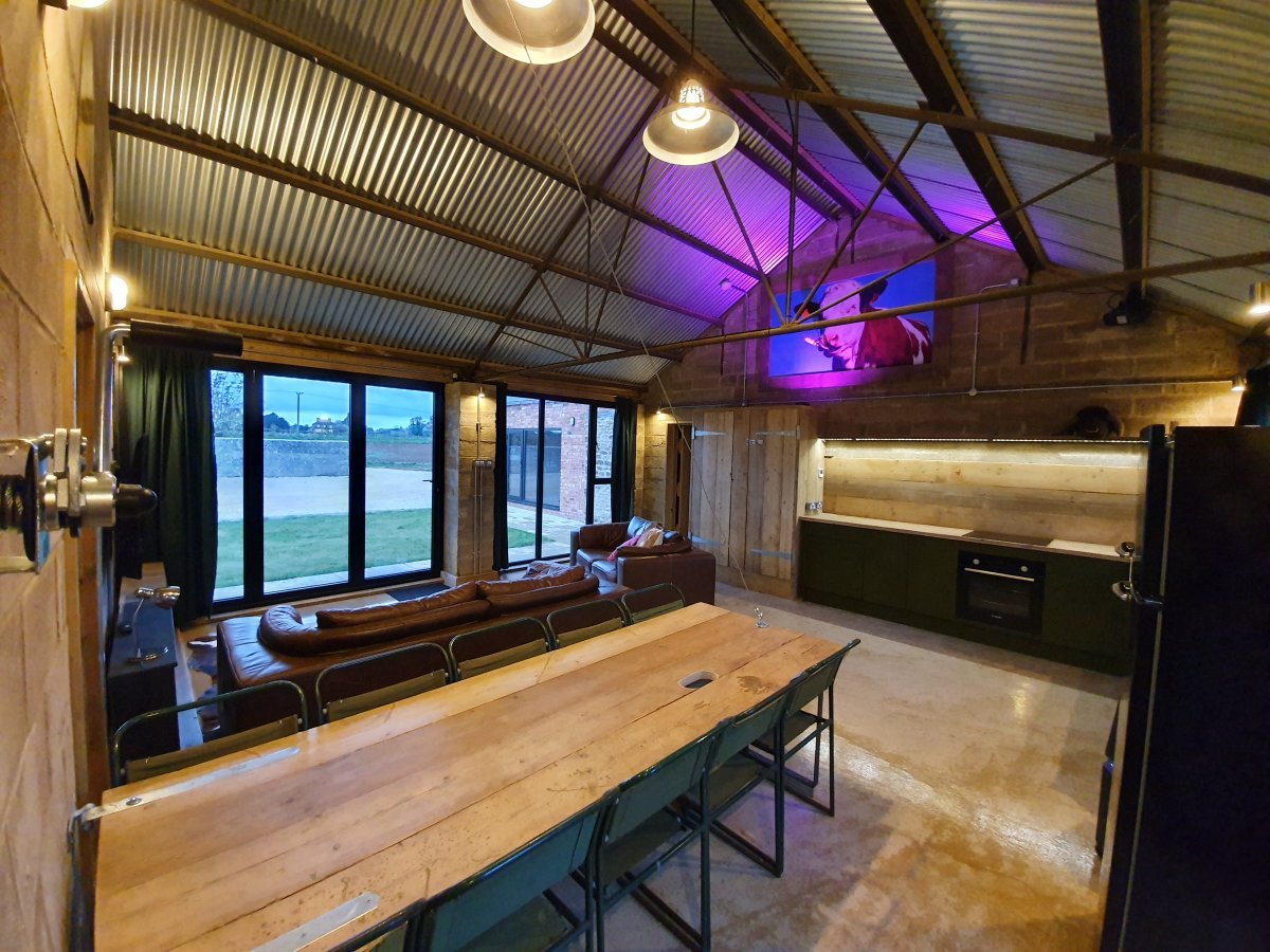 Cow Shed dining for 10, table winds up to create dance floor