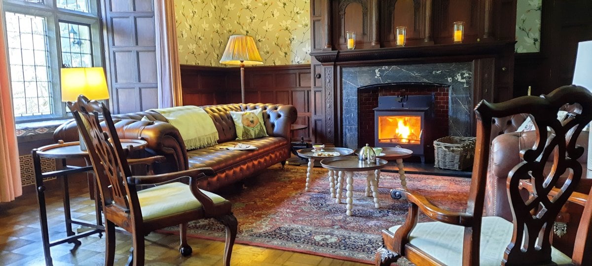 Comfy sofas in front of a cosy fire