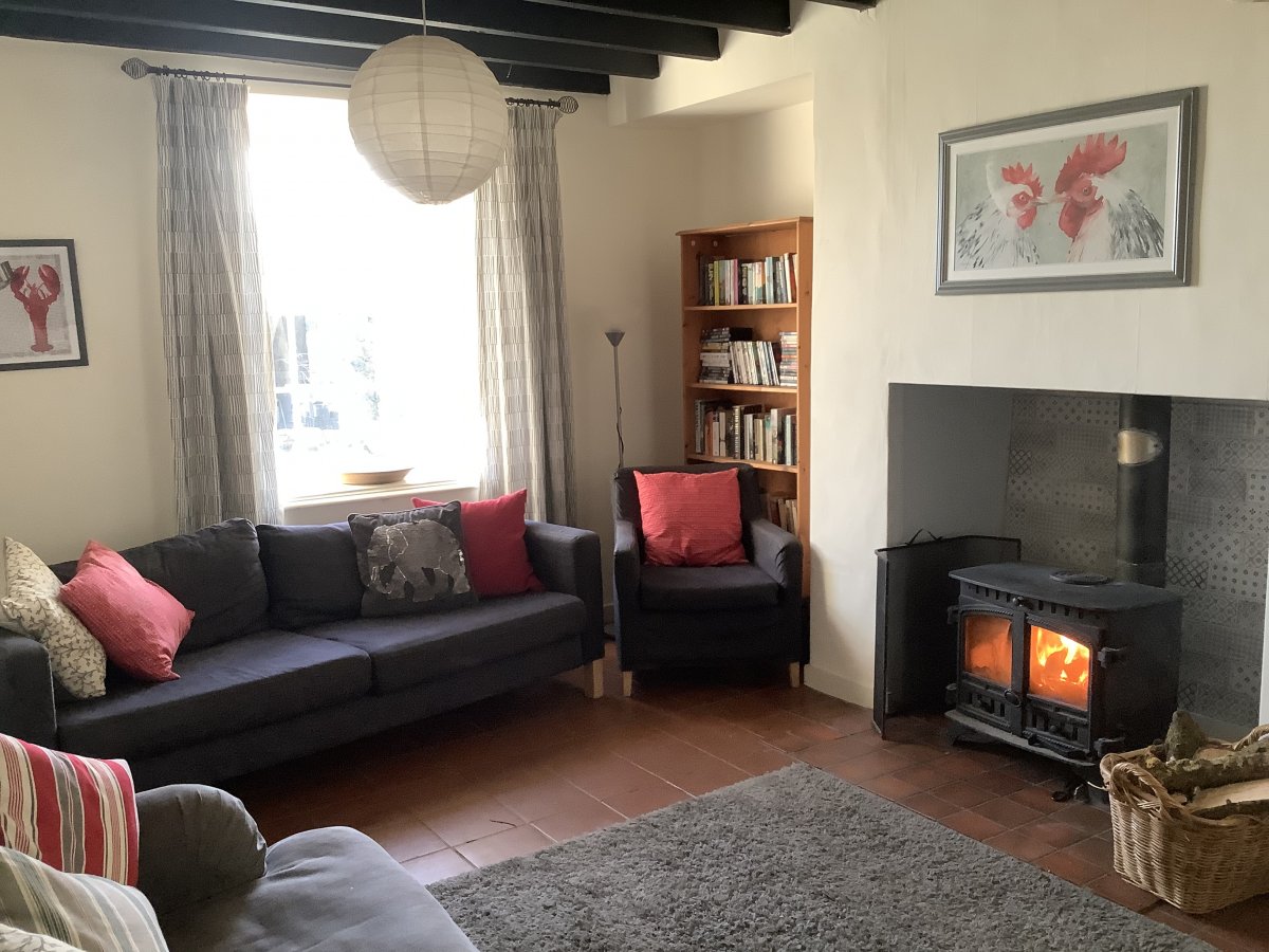 Relax in our comfortable sitting room with log burner