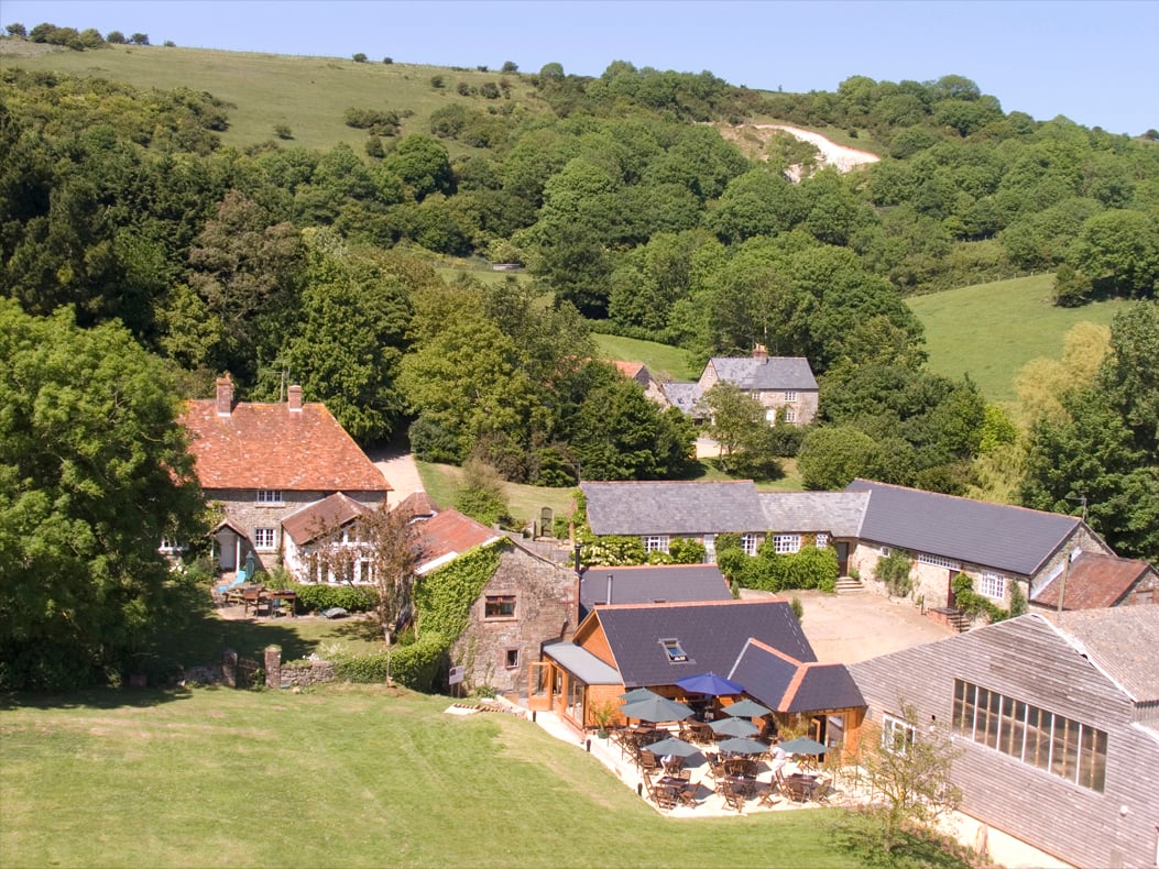 Aerial view of the farm with restaurant patio in foreground