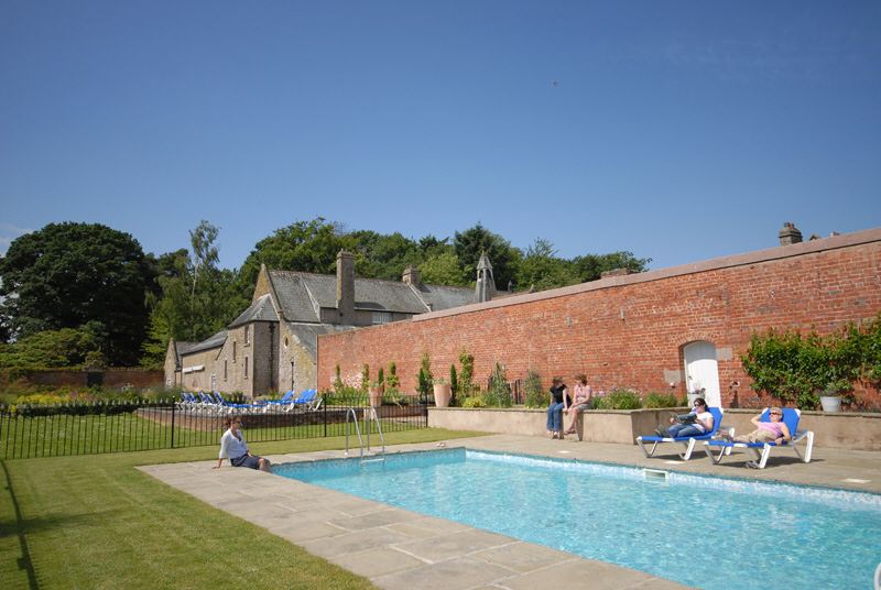 Relax by the pool in the Colloquy Garden