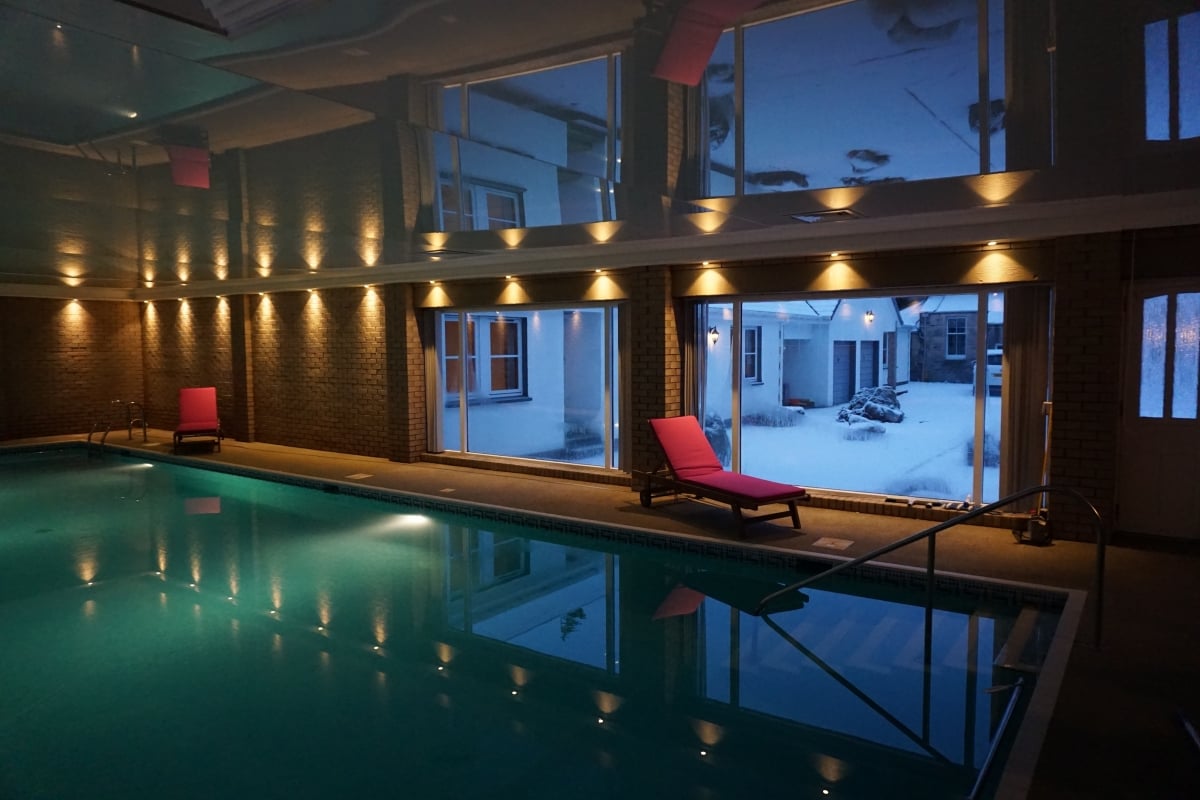 Swimming pool overlooking entrance courtyard