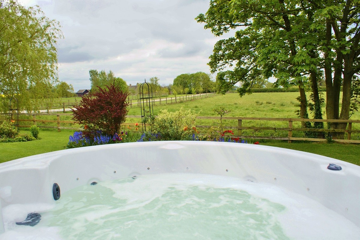 Exclusive use of a hot-tub in private lawns, with BBQ and picnic table.