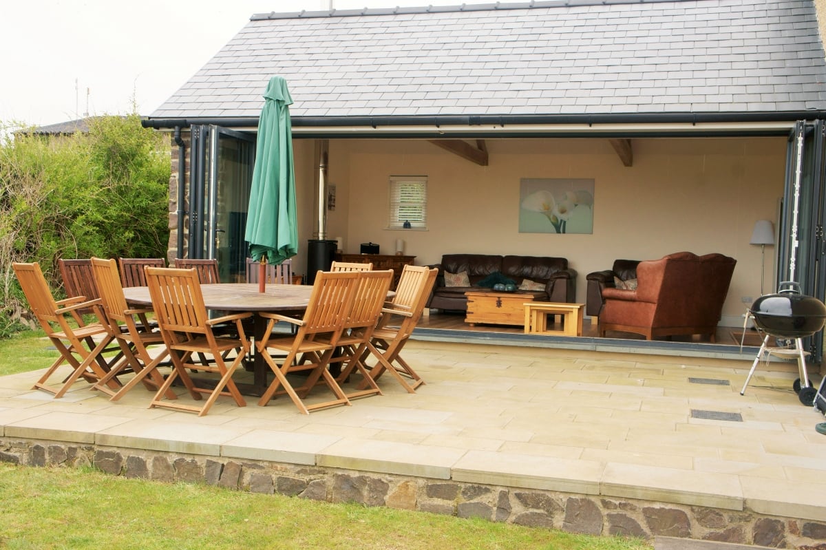 Bi-folding doors open onto the patio