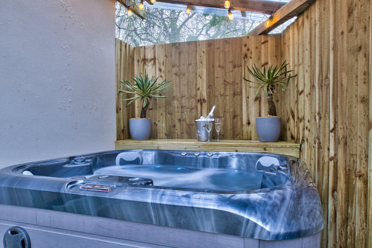 Take a dip in the hot tub at Olive Cottage