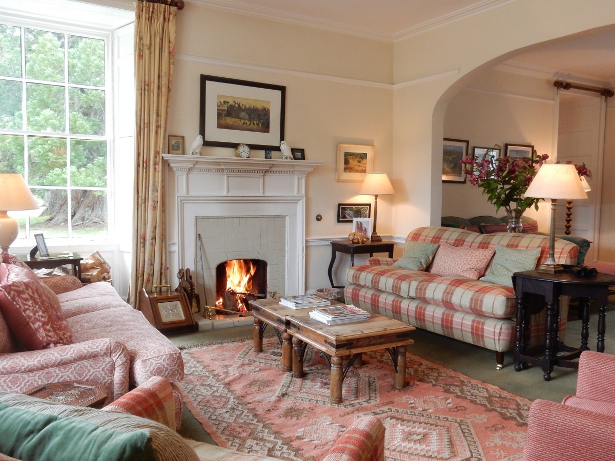 Sitting room at Dalmigavie with an open fire