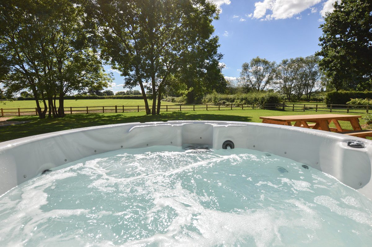 Exclusive use of a hot tub in private lawns with a BBQ and picnic table