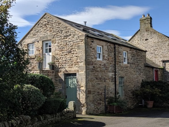 Exterior of the hayloft studio flat at Southlands Farm Cottages