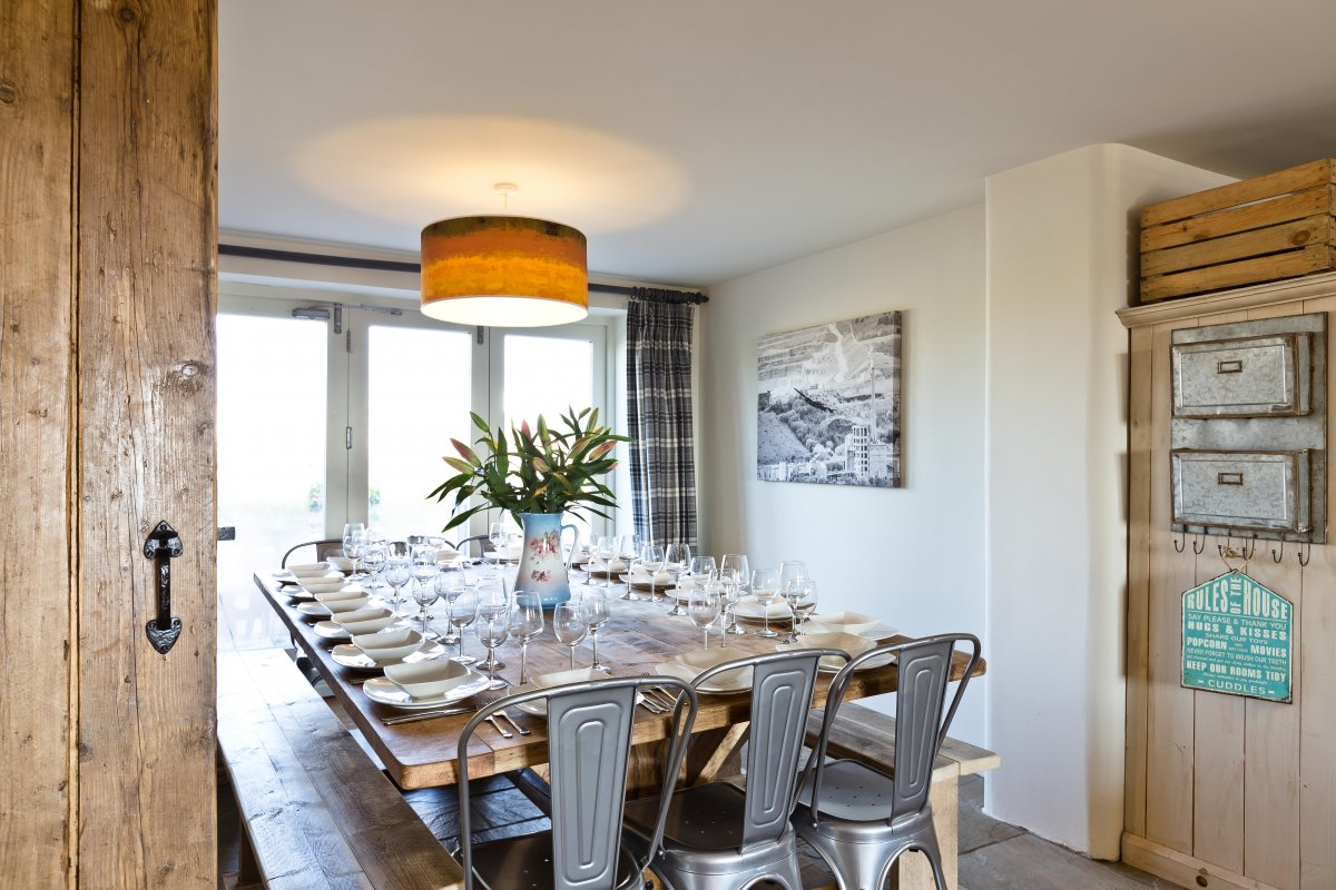 Dining for up to 18 with folding doors onto decked area