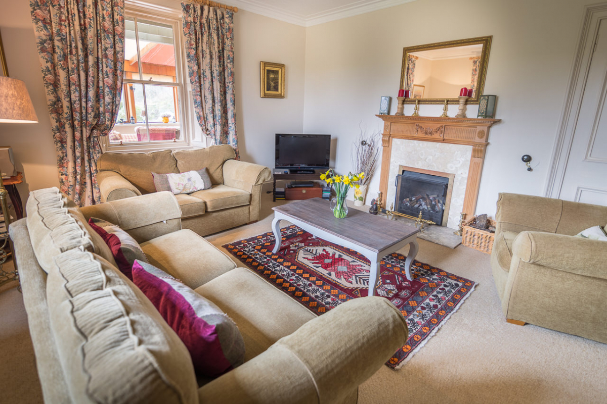 Cosy sitting room with open fire