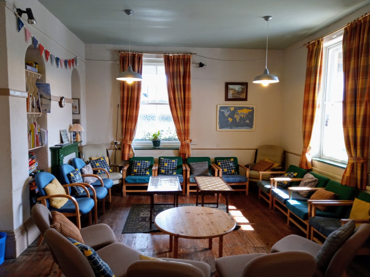 Lounge area with piano, pool table and board games